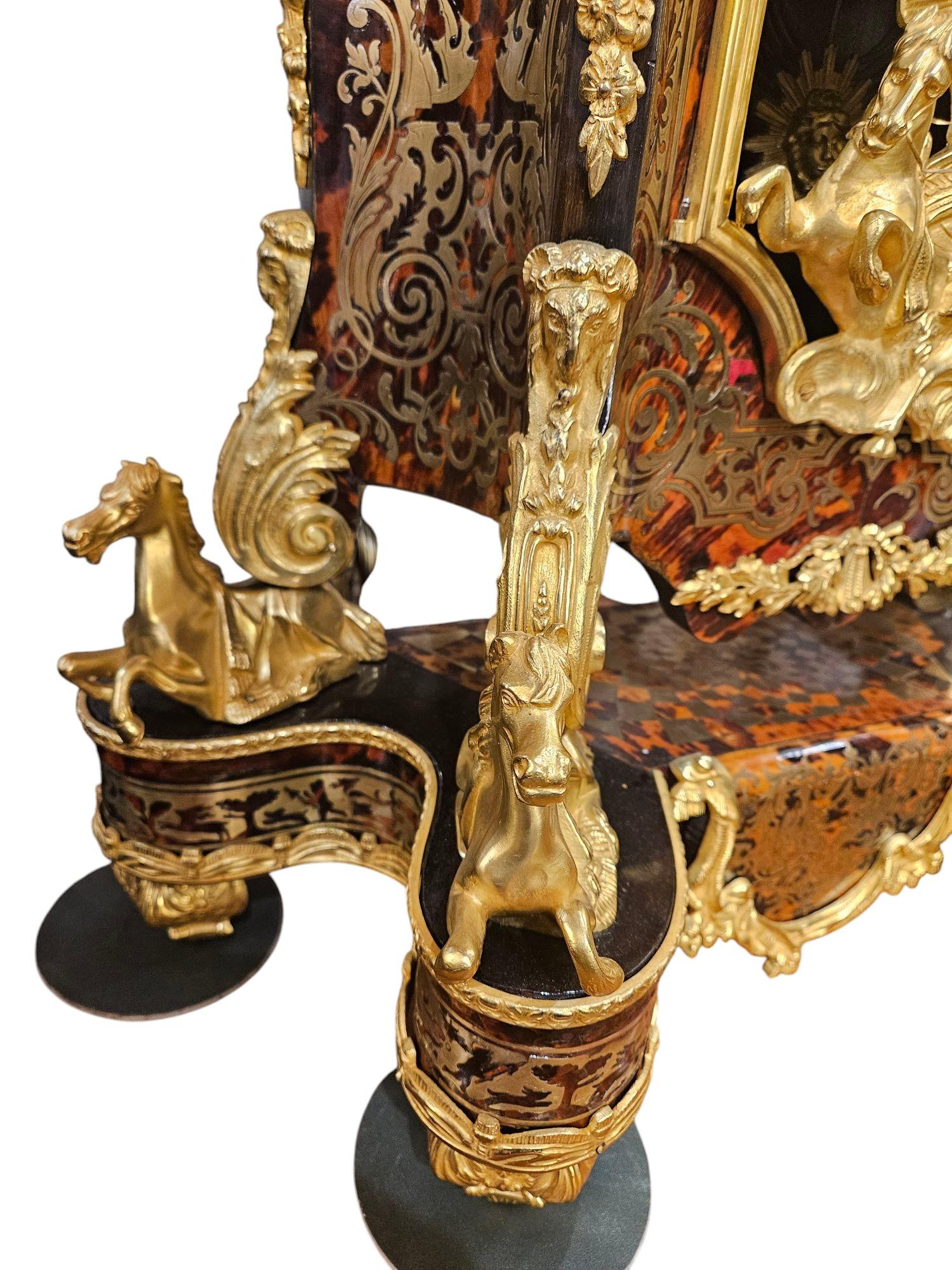 A very Important  French Ormolu Mounted Boulle Mantel Clock
Inlaid Brass in The Regency Style
Each Corner Decorated with Recumbent Horses
Nice Large Dial 8 and a half inches surrounded by Enamel Plaques
Completely Restored and Movement Serviced
