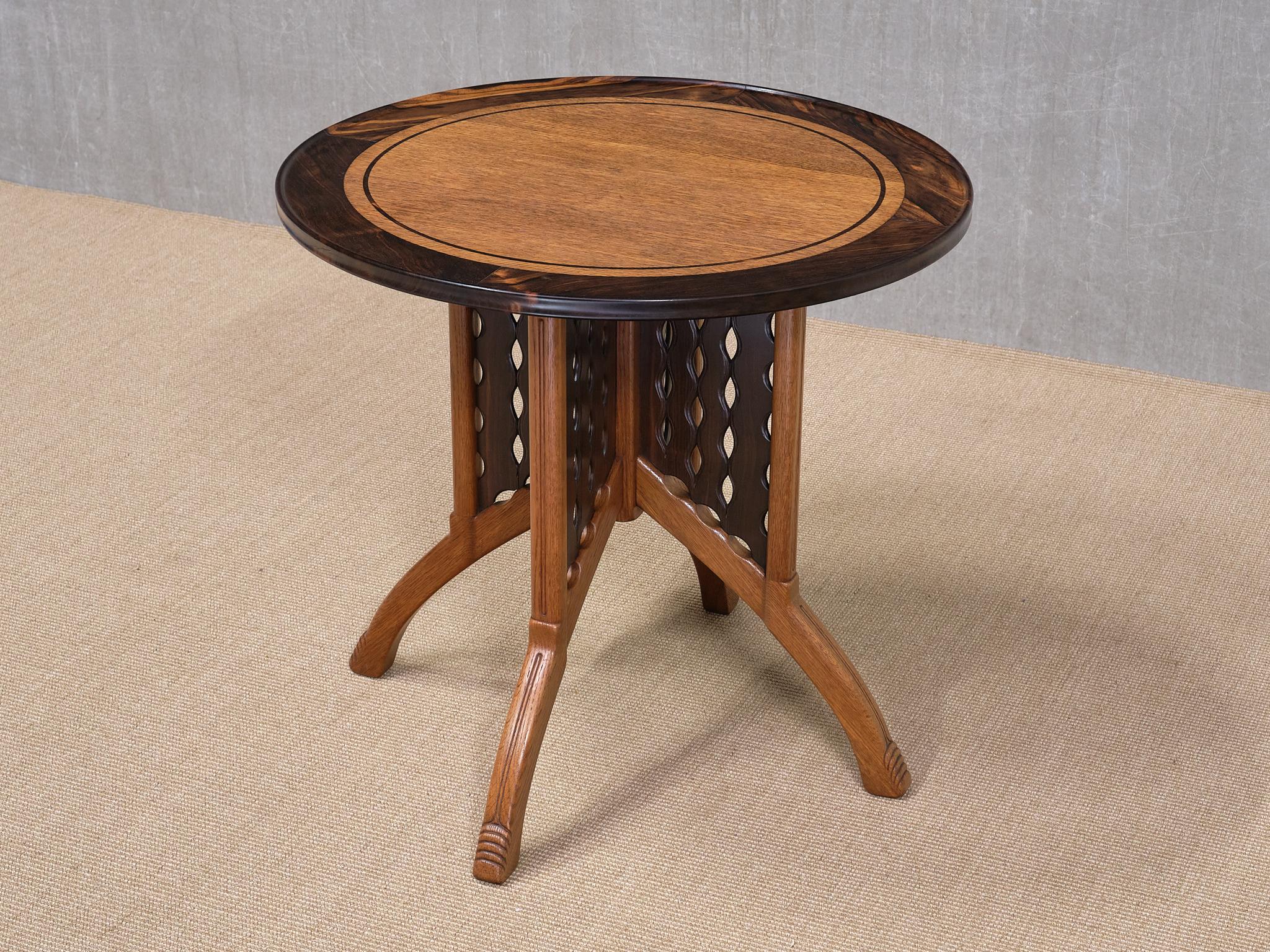 This exceptional center table was produced in the Netherlands during the 1920s, most likely by the company H.P. Mutters & Zoon in The Hague, with the design attributed to Carel Adolphe Lion Cachet.

The striking design features a four-legged base