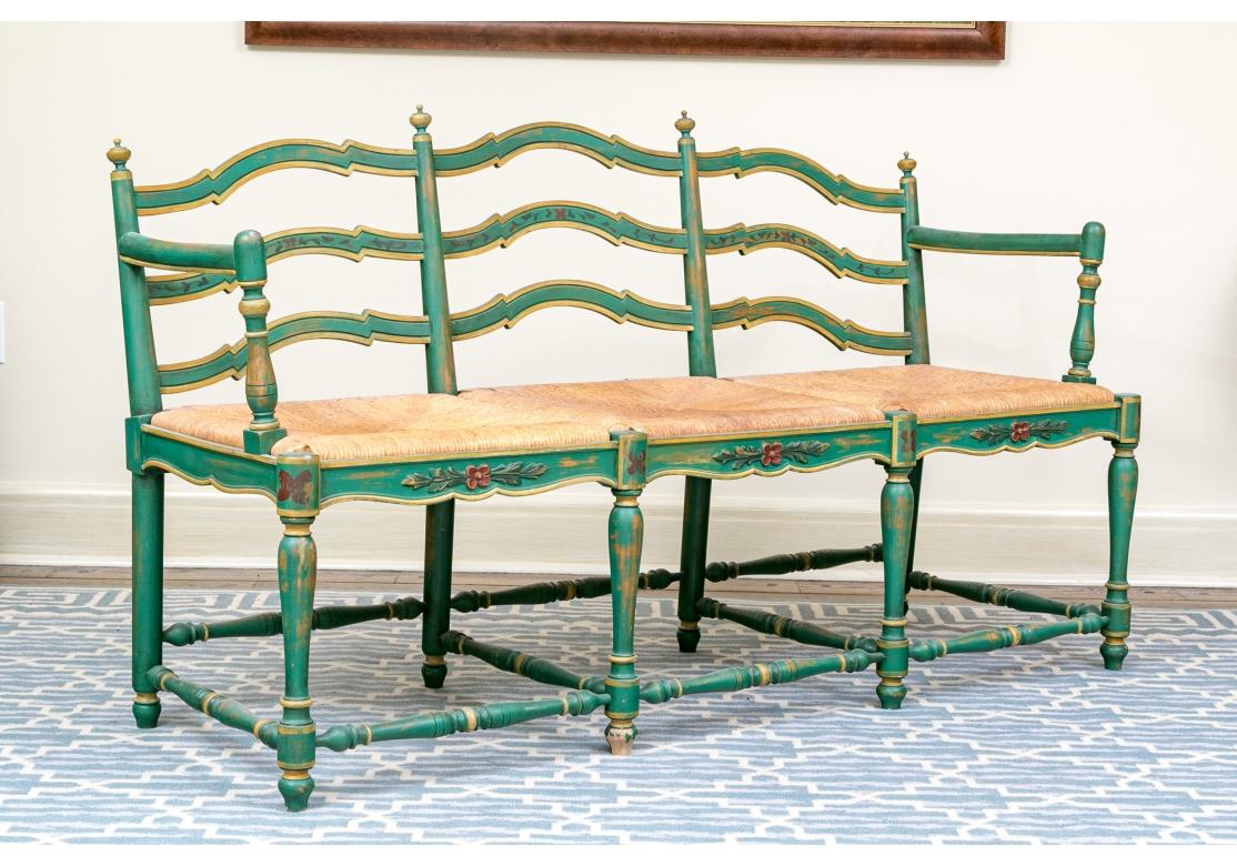 Colorful, stylish and very well made three seat Painted Bench. On six turned legs with stretcher supports providing support to the upper frame with well  carved seat back with arched carved ladder back with four finials to the seat back. Two arms