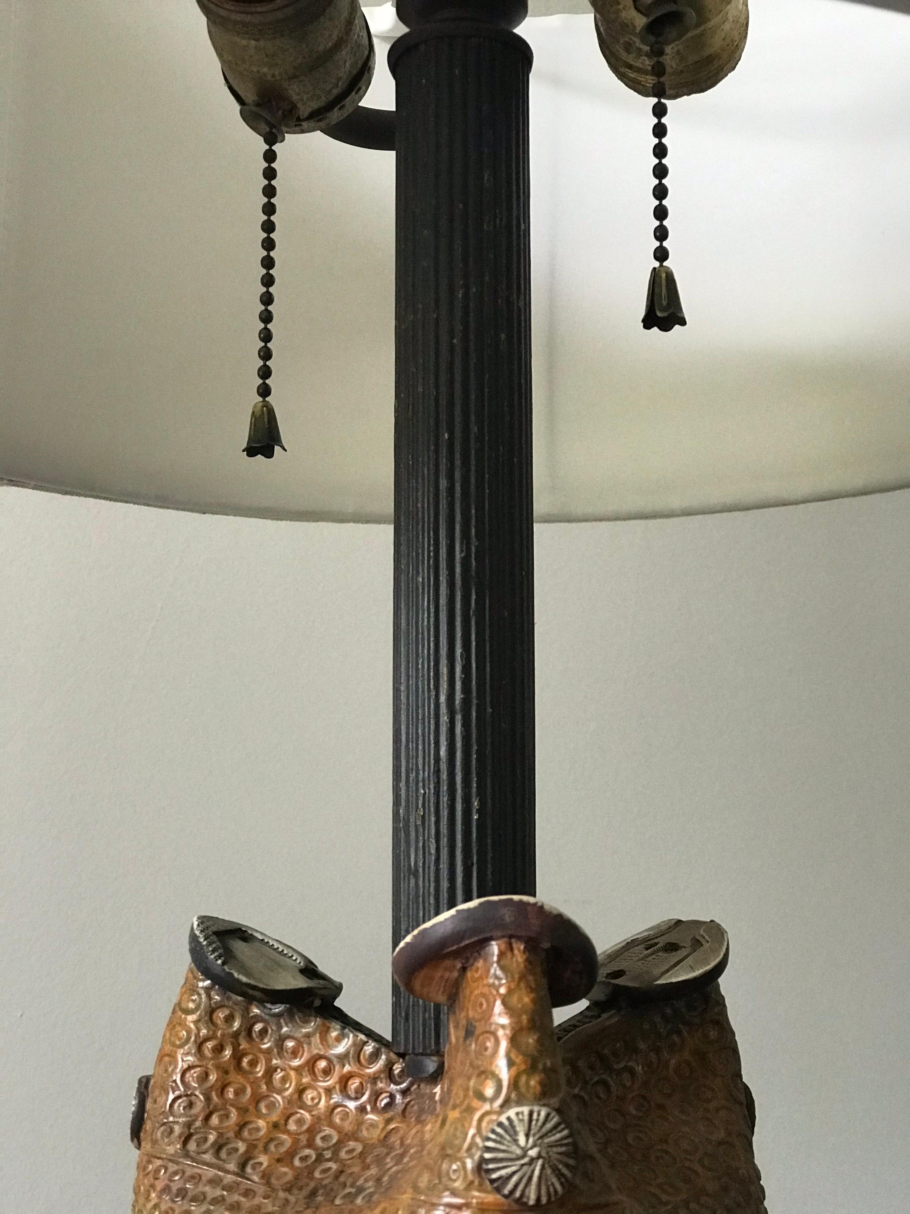 An unusual and large ceramic lamp by Bengt Berglund for Gustavsberg. Large ceramic base sits on a wood stand, with a long neck and double pull chain socket. Completely unique to the market. 

It's possible this was a ceramic sculpture that was
