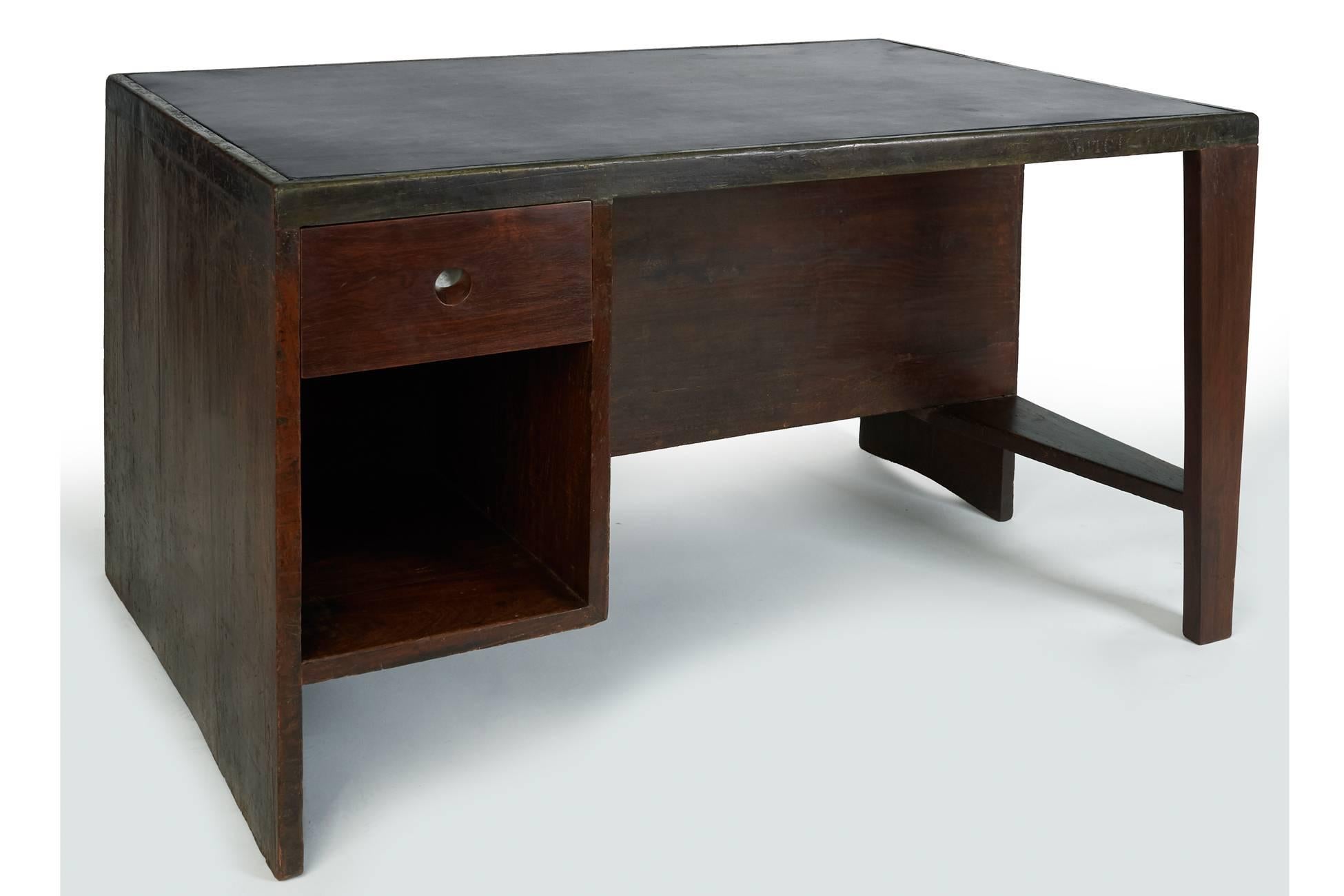 Pierre Jeanneret (1896–1967)

An exceptional floating desk with gracefully arched legs and a harmoniously integrated pigeonhole bookcase on the reverse, by Pierre Jeanneret for the Administrative Buildings in Chandigarh, India, designed by Le