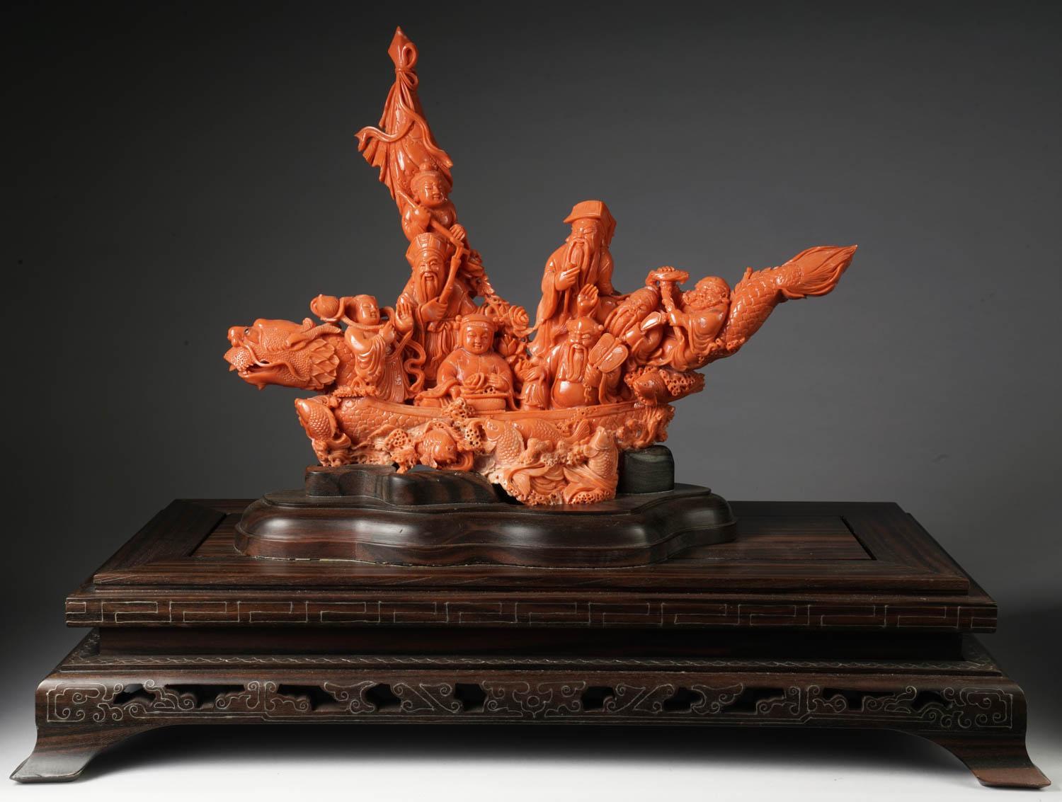An exceptional Chinese carved coral figural group or statue of a boat with eight immortals. The boat in a form of a carved dragon with fish throughout.

Very finely carved. 

Coral measures: 10