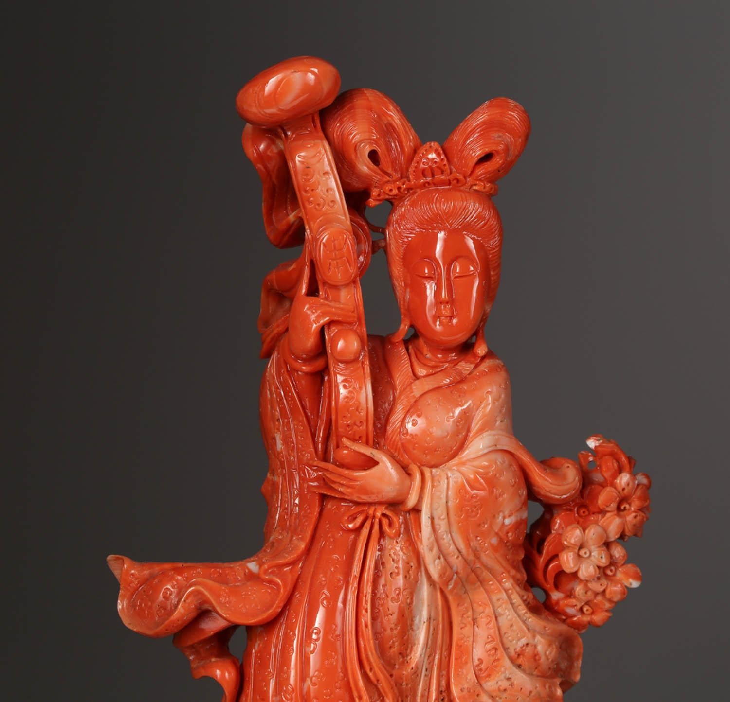 An exceptional Chinese carved coral figure of a Guanyin with deer.

Very finely carved. With original wooden base.

Measures: Coral: 12