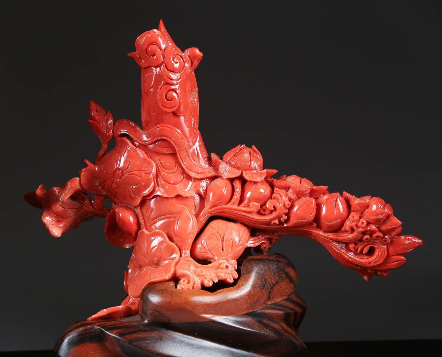 An exceptional Chinese carved coral figure of a seated Guanyin.

Very finely carved. With original wooden base.

Coral: 8
