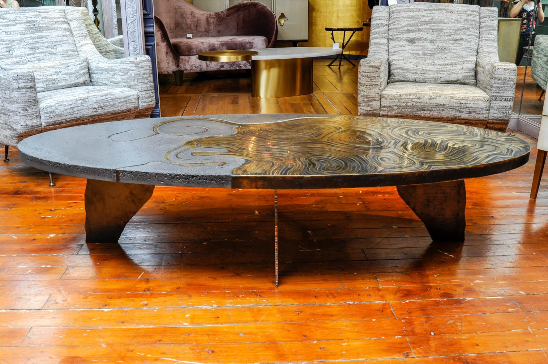 This wonderful coffee table is made of brass marquetry and concrete. Feet are made of metal and the entire piece of furniture is a sculpture. It is part of a limited edition signed and numbered 1/8.