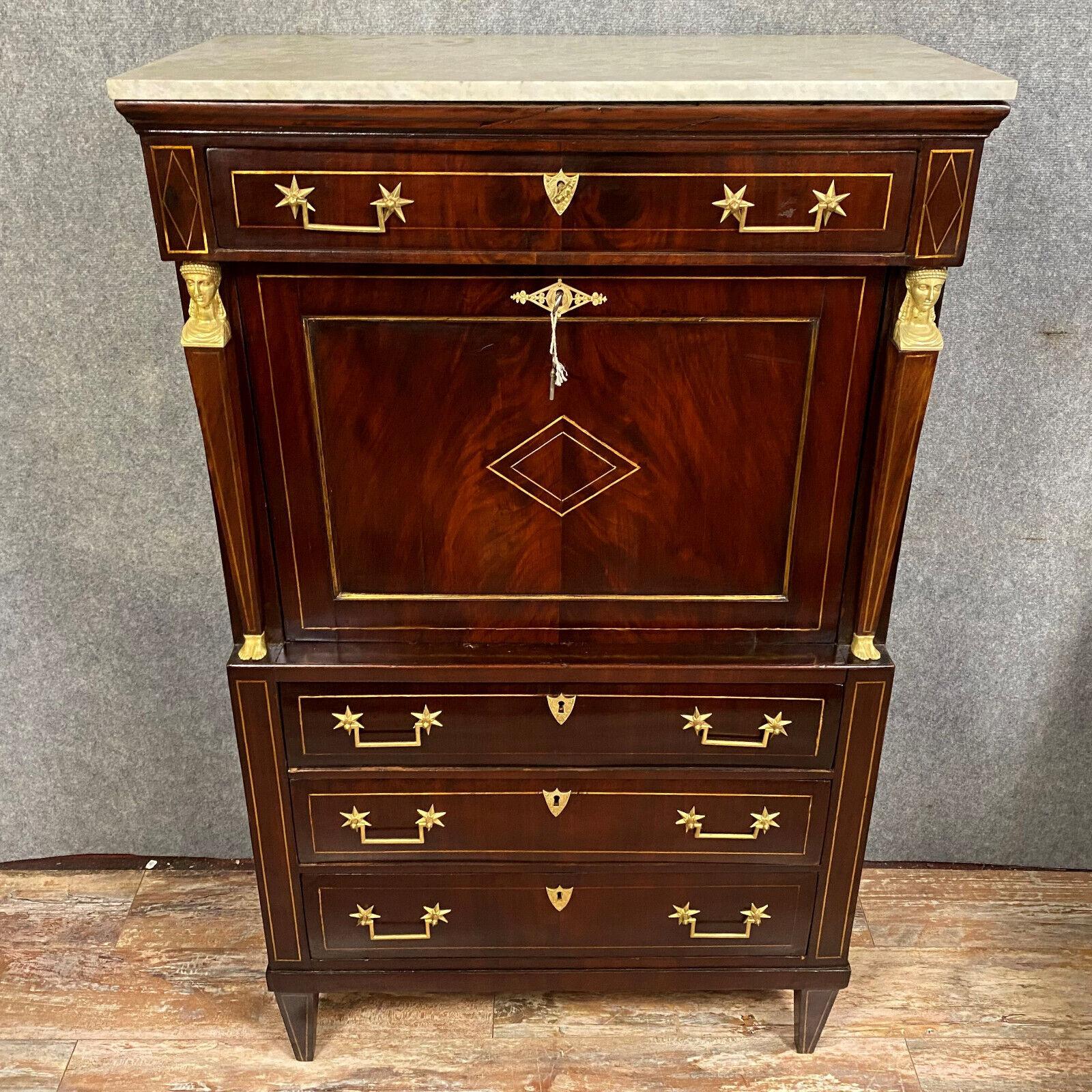 Step into the grandeur of the Consulate era with this exceptional mahogany secretary, crafted towards the end of the 18th century. Rich in history and elegance, this piece embodies the sophistication and style of its time, making it a prized
