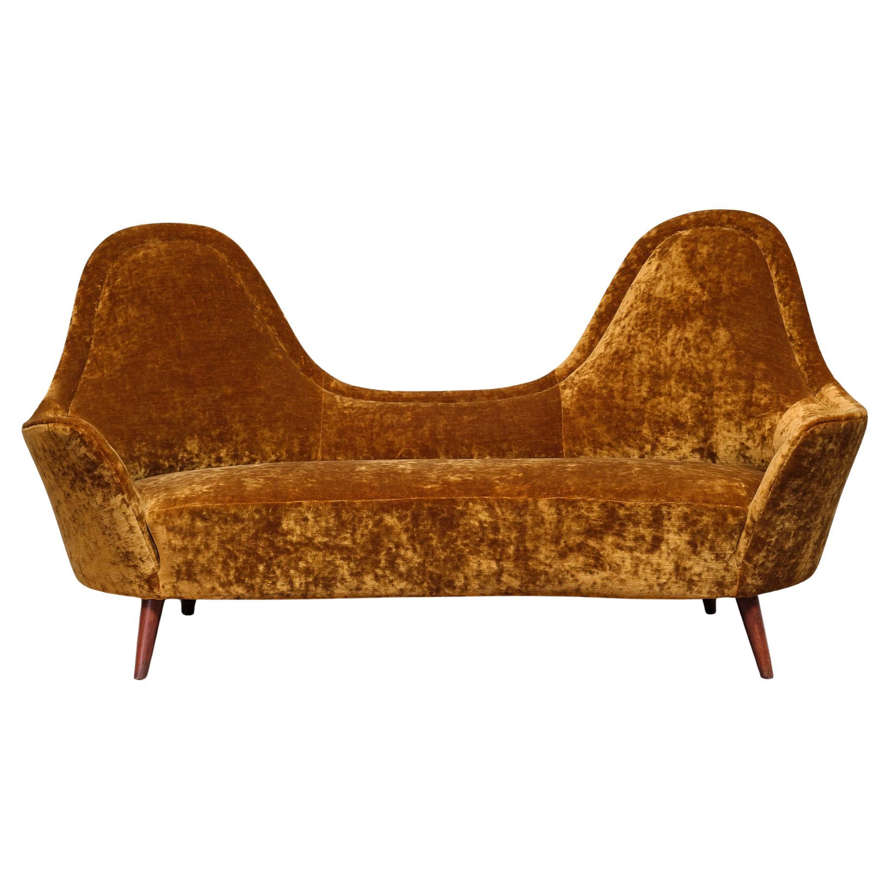 What is the difference between high-back and low-back sofas?