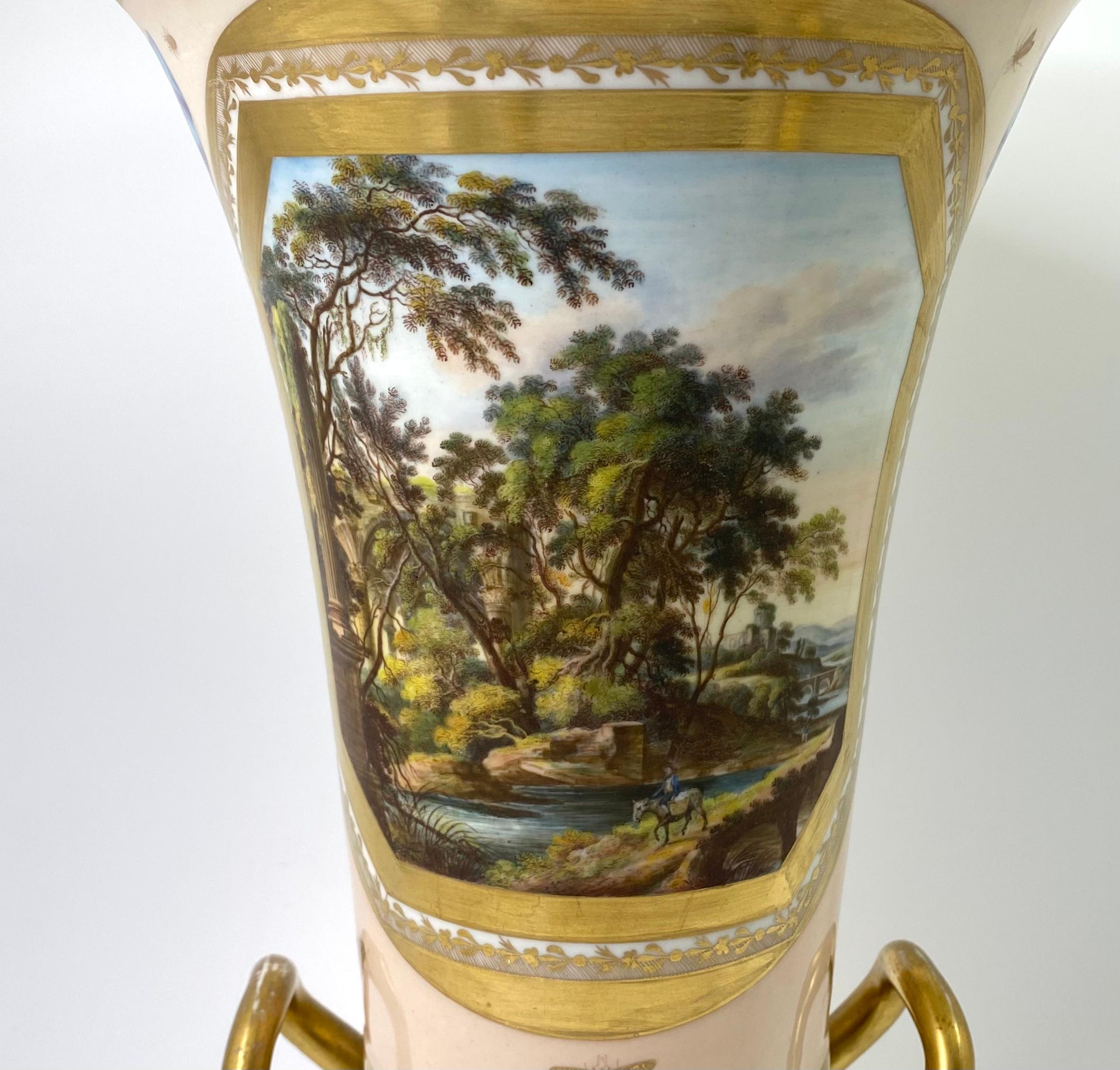 An exceptional and rare Derby porcelain two part vase, c. 1810. Finely painted in the manner of Daniel Lucas, with an oval panel, depicting a traveller riding a donkey before a river, in a woodland landscape. A ruined monastery, and a bridge in the