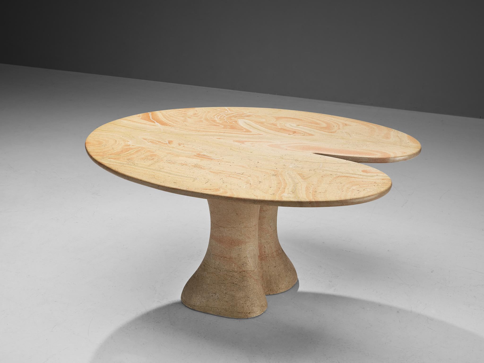 Dining or center table, limestone, Europe, 1980s

This breathtaking table has a strong decorative character and hits the border between art and furniture design. The top epitomizes a vivid construction based on a lily pad with its broad, rounded,