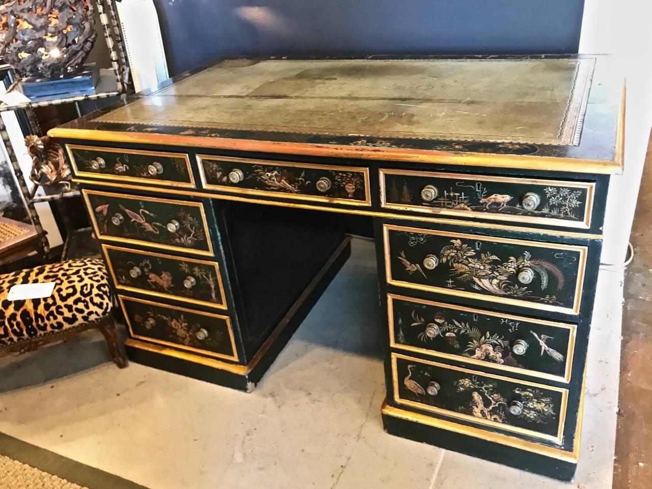 Superb double pedestal three-part Japanned desk. The desk is a faux partners desk dating from the early to mid-19th century. It features original detailed raised Chinoiserie decoration, the gilt edges have been refreshed. The faux drawers on the