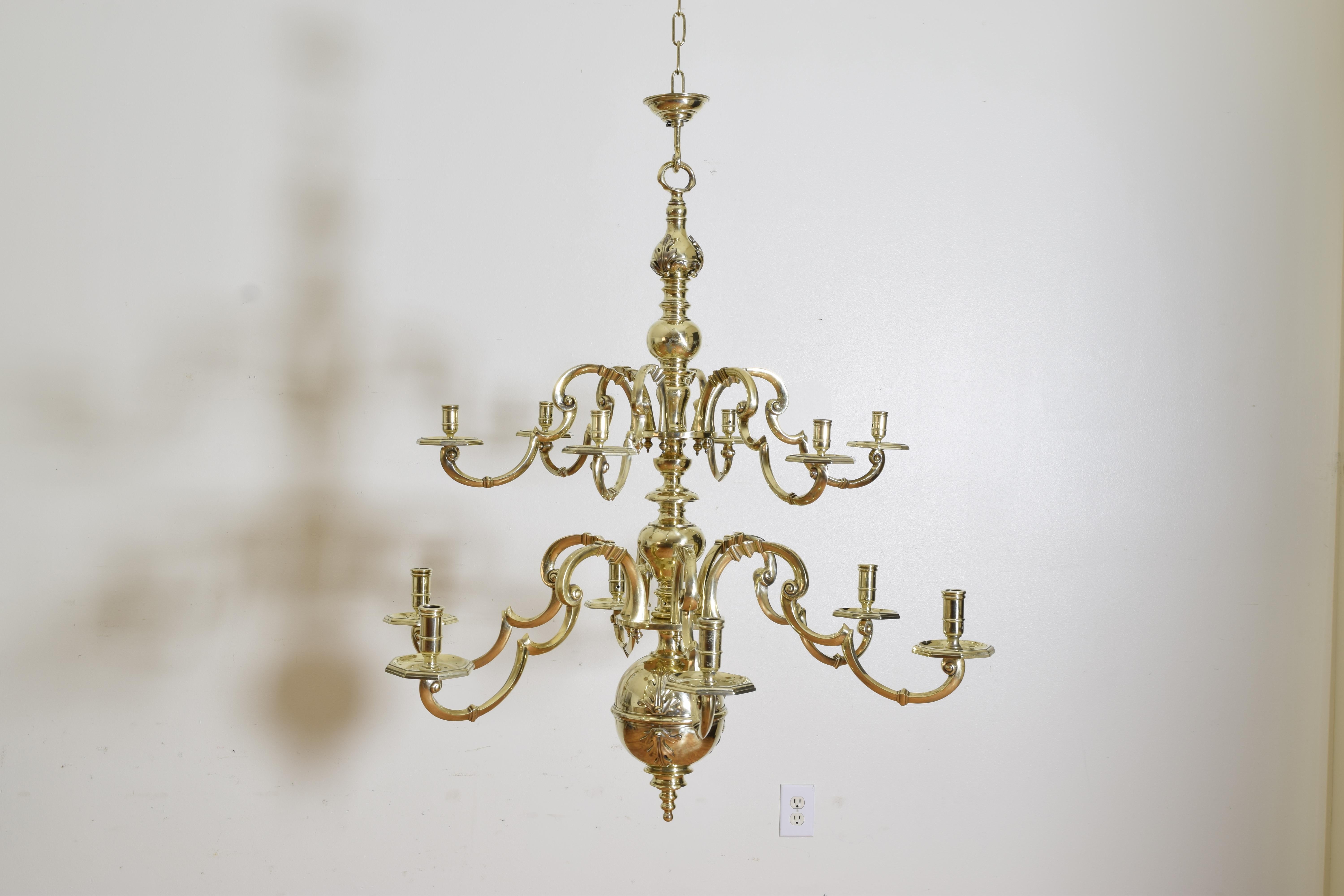 Of unique design and of exceptional quality this larger scale chandelier features two tiers with the upper tier having slightly smaller arms, originally a candle chandelier and now outwired with the wires reaching the interior and exiting the top,