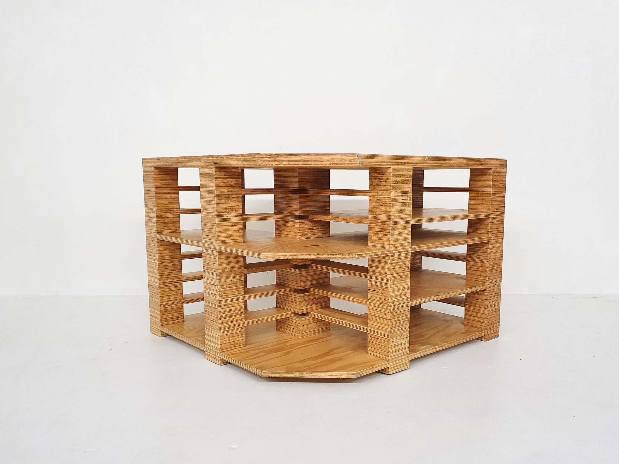 Plywood desk to be placed free standing or in a corner. Designed in The Netherlands , probably in the eighties
Very nicely made of plywood glued together to create several storage shelves. No screws are used anywhere
The desk is a-symmetrical, the
