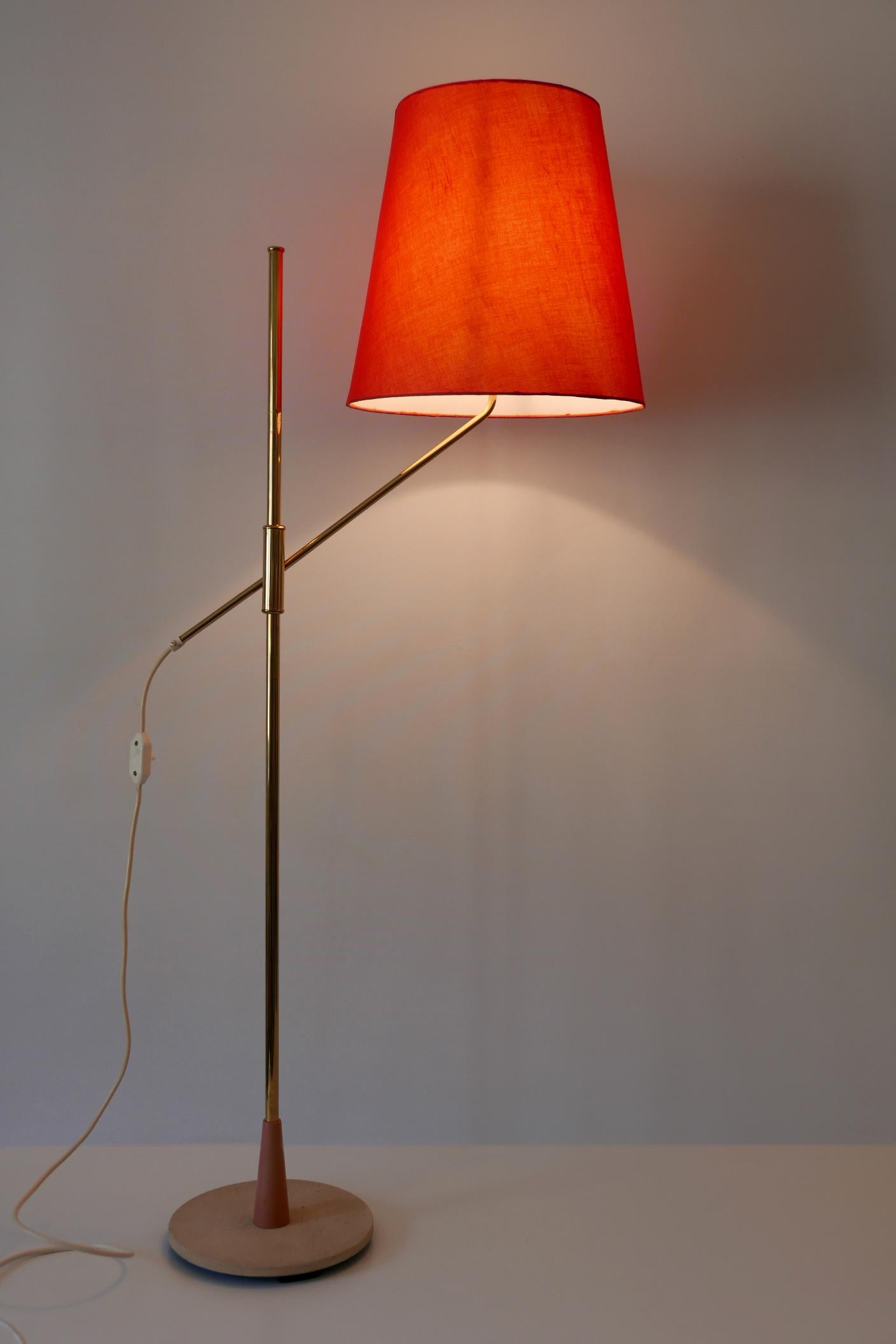 Elegant Mid-Century Modern floor lamp with adjustable height. Designed and manufactured in 1950s, Germany.

Attention: The lamp comes without lamp shade and in disassembled condition for economy international shipping.

Executed in brass, the lamp