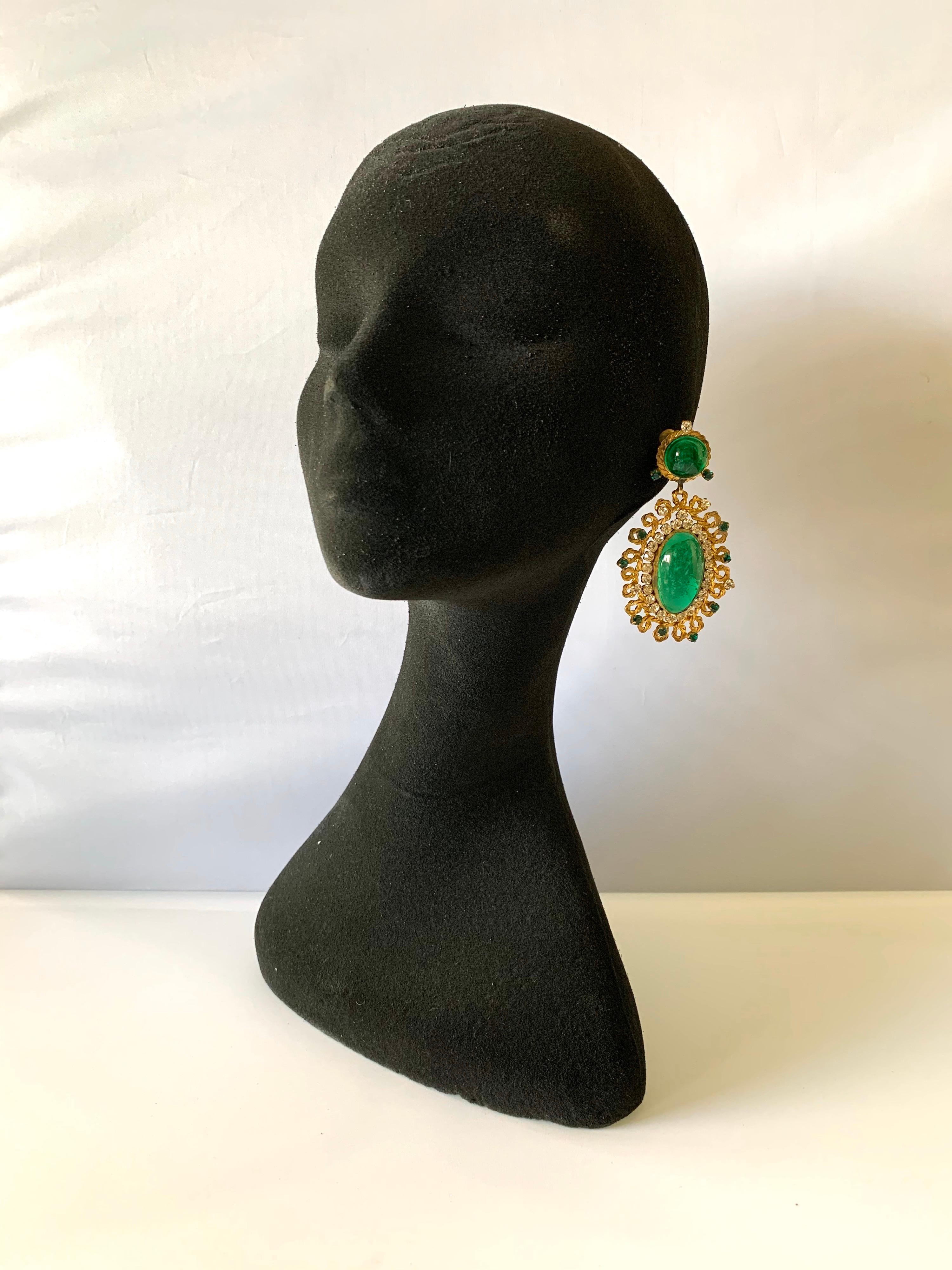 Exceptional vintage large faux emerald and diamante drop clip-on statement earrings - the statement earrings are comprised out of hand-manipulated gilt metal and feature an ornate design which is accented by diamante and emerald diamante rhinestones