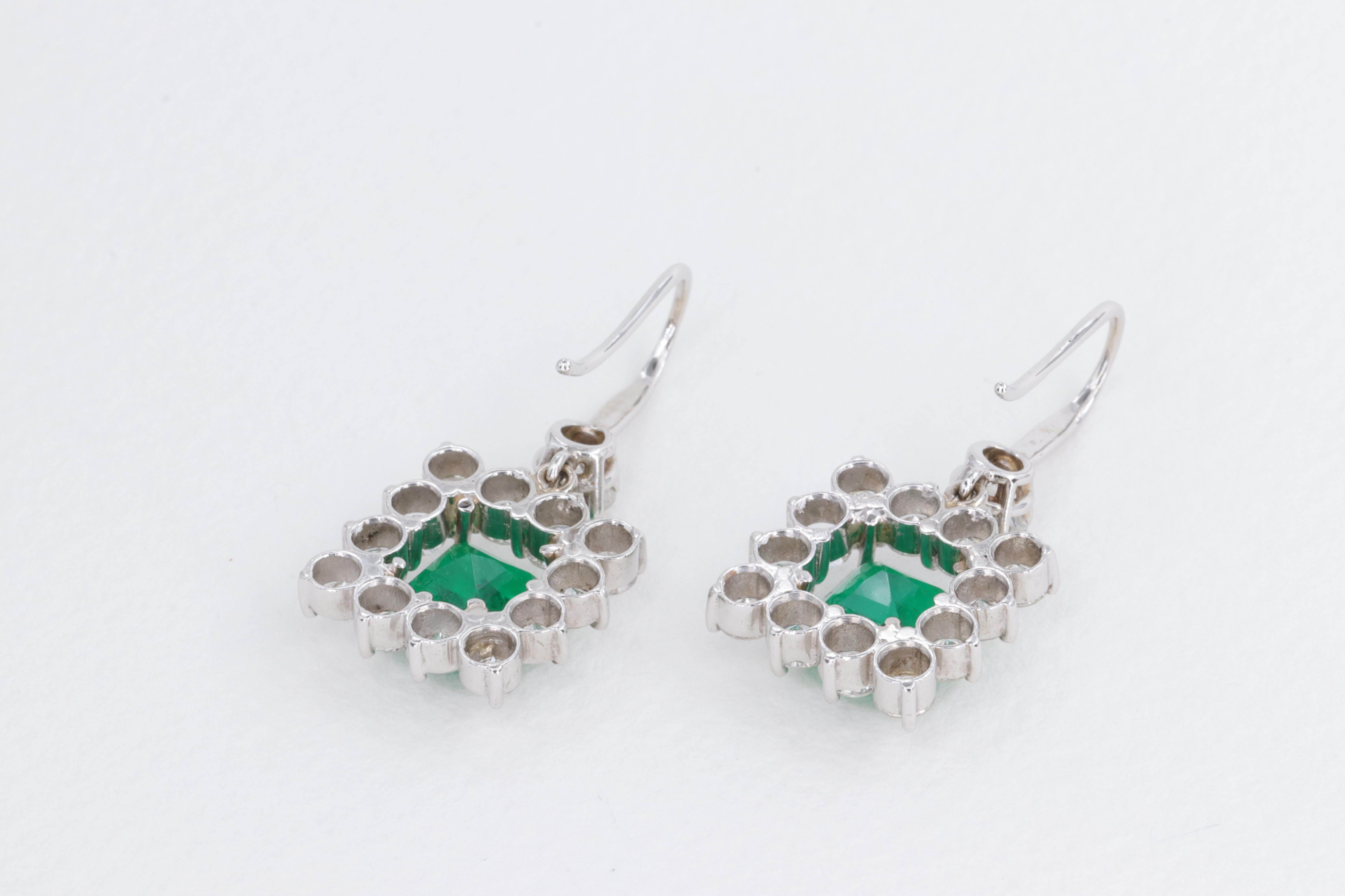 Exceptional Emerald and Diamond Halo Dangle Earrings Set in 18 Karat White Gold For Sale 1