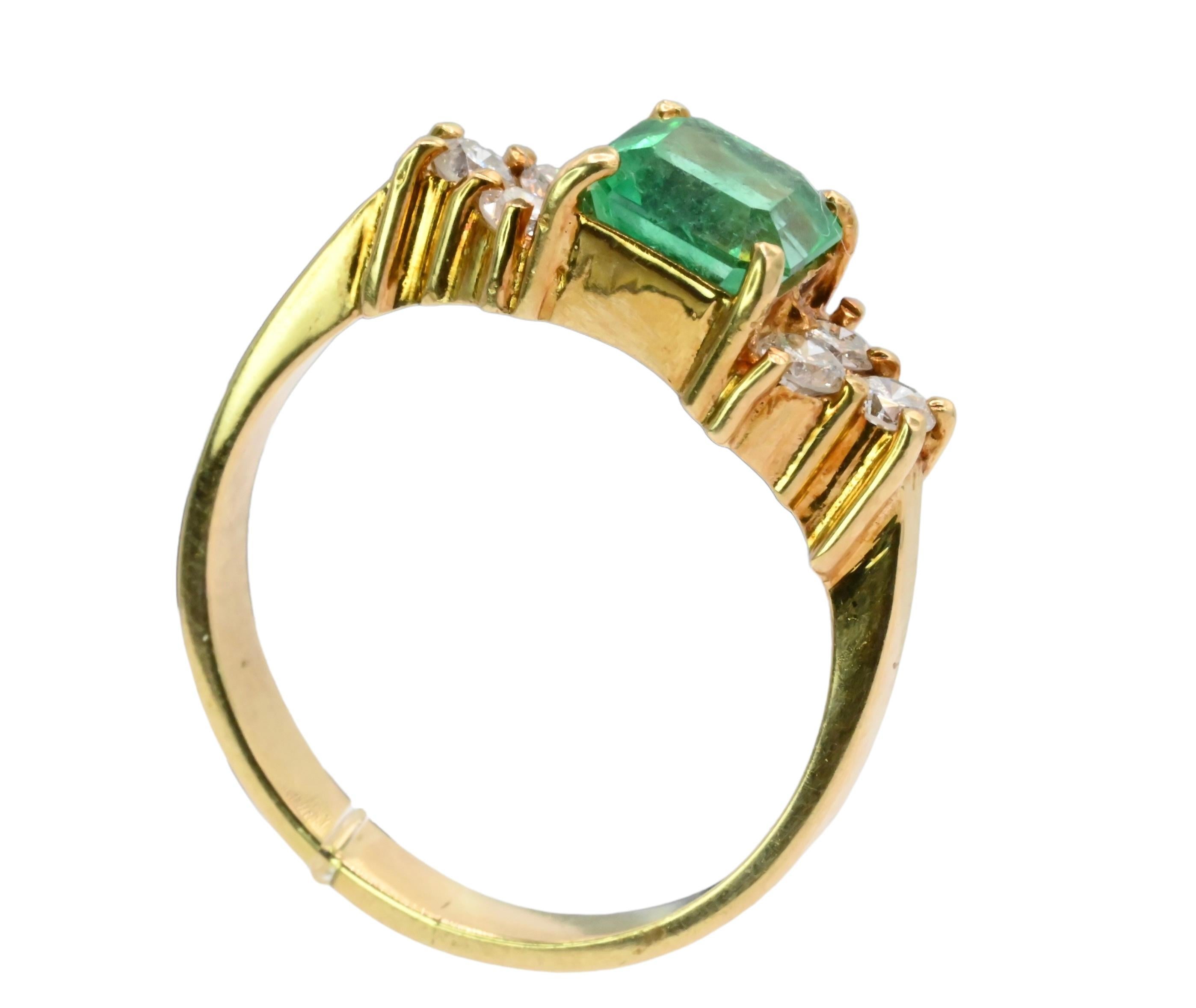 This is a fabulous emerald and diamond ring. The ring consist of approximately a 1.25 carat emerald center stone. It has such a vivid lush green color. There are six accent diamonds on the sides, eacg diamond is around .10 carats. Quality of the