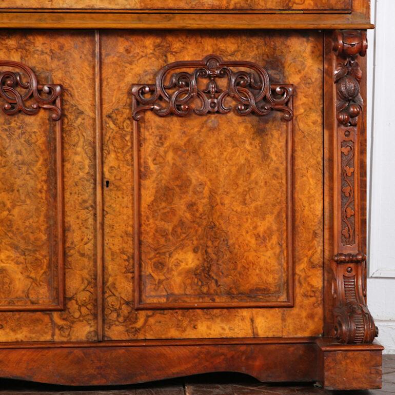 Exceptional English Victorian burl walnut secretary, the fitted desk folding down to reveal leather writing surfaces which open to compartments below, and with a pop-out fitted tray behind for pens and inkwells etc. Further little drawers and