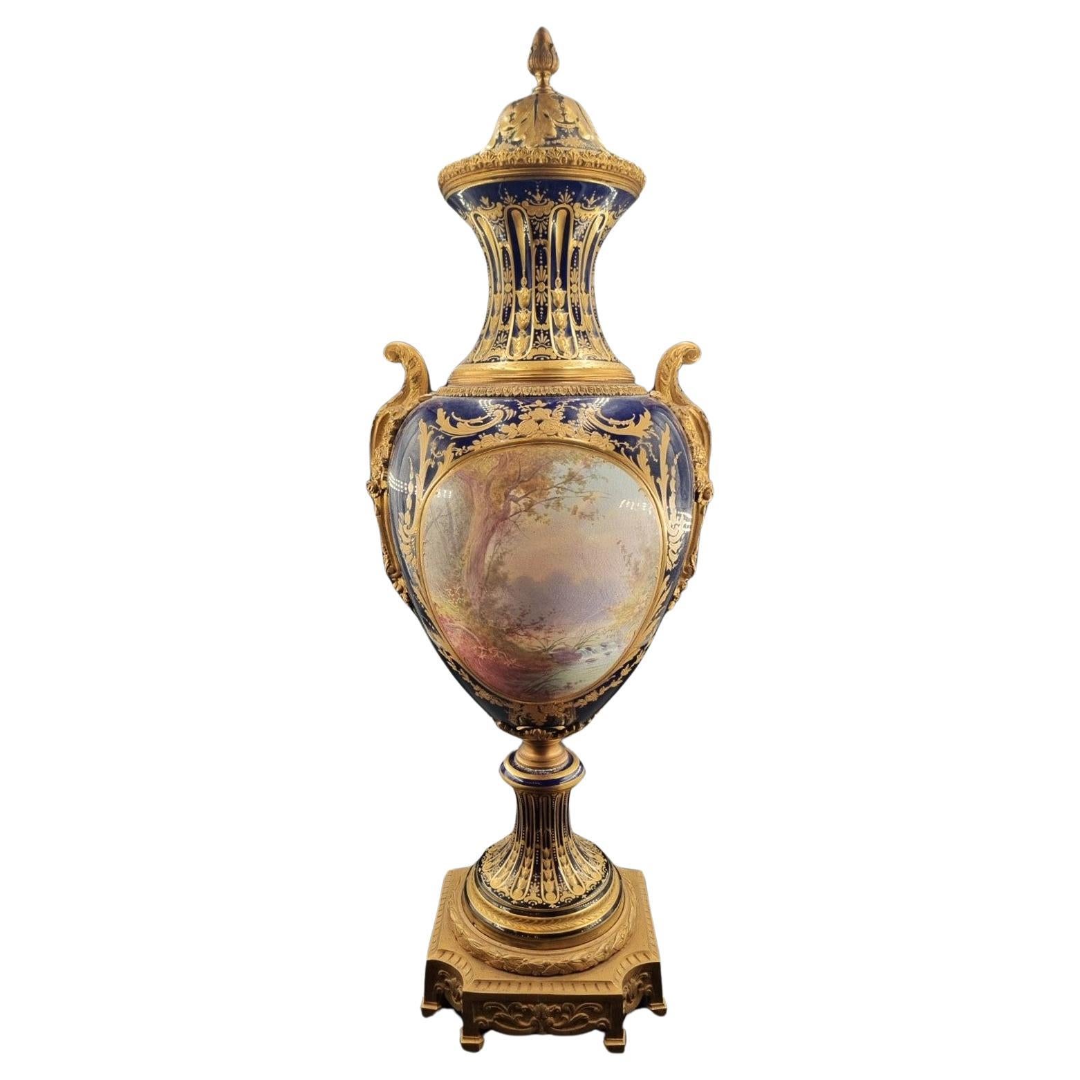 AN ORMOLU-MOUNTED SEVRES COBALT-BLUE GROUND VASE AND COVER
EARLY 19TH CENTURY


(81 cm.) high