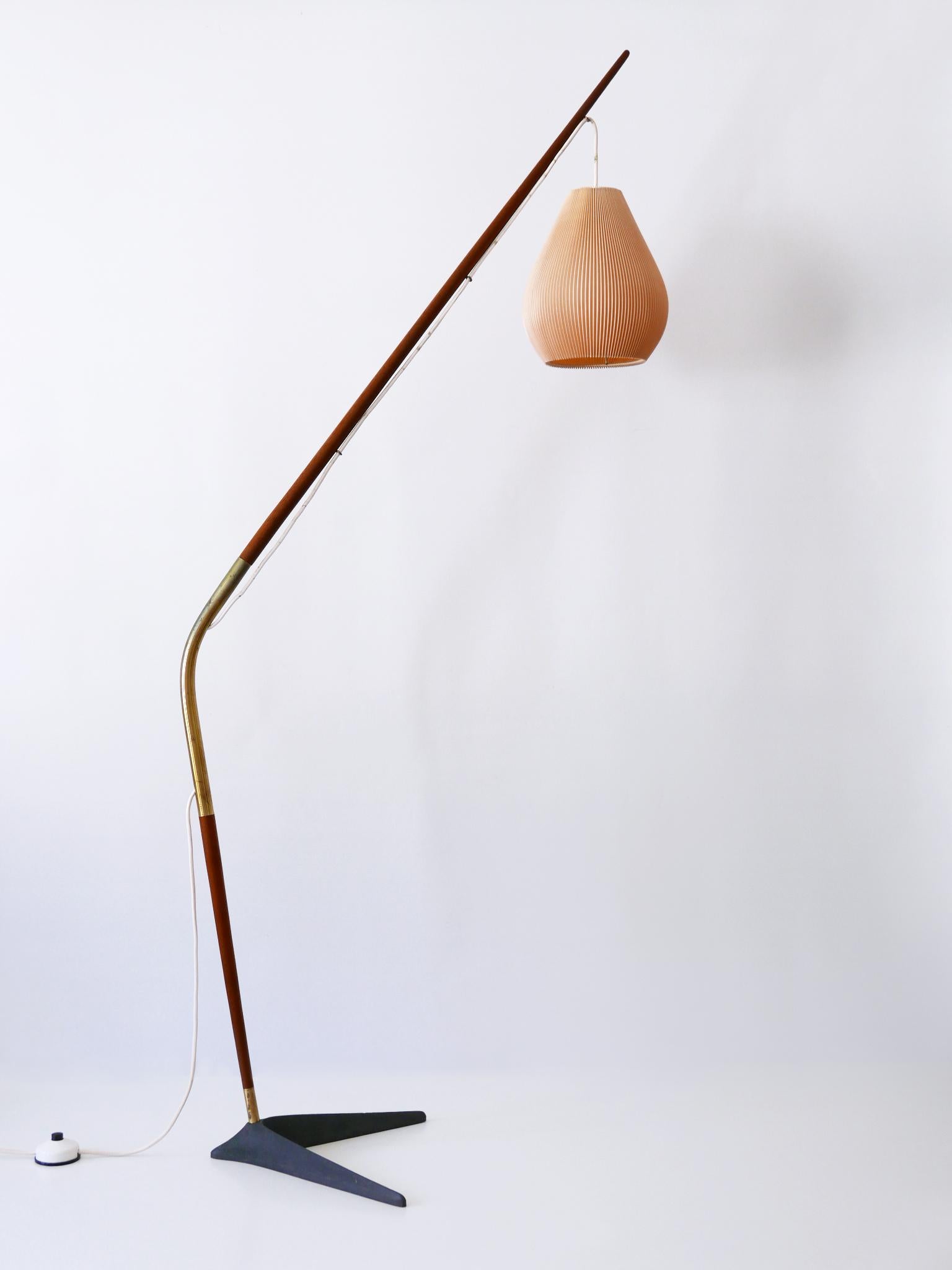 Absolutely rare, elegant and highly decorative Mid-Century Modern floor lamp or reading light 'Fishing Pole'. The drop height of the lamp shade is adjustable. Designed by Svend Aage Holm Sørensen for Holm Sørensen, Denmark, 1950s.

Executed in teak,