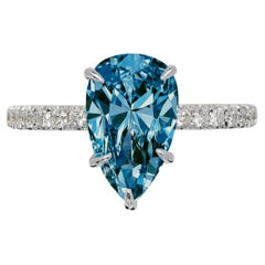 Exceptional Flawless GIA Certified Fancy Intense Blue Pear Cut Diamond Pave Ring