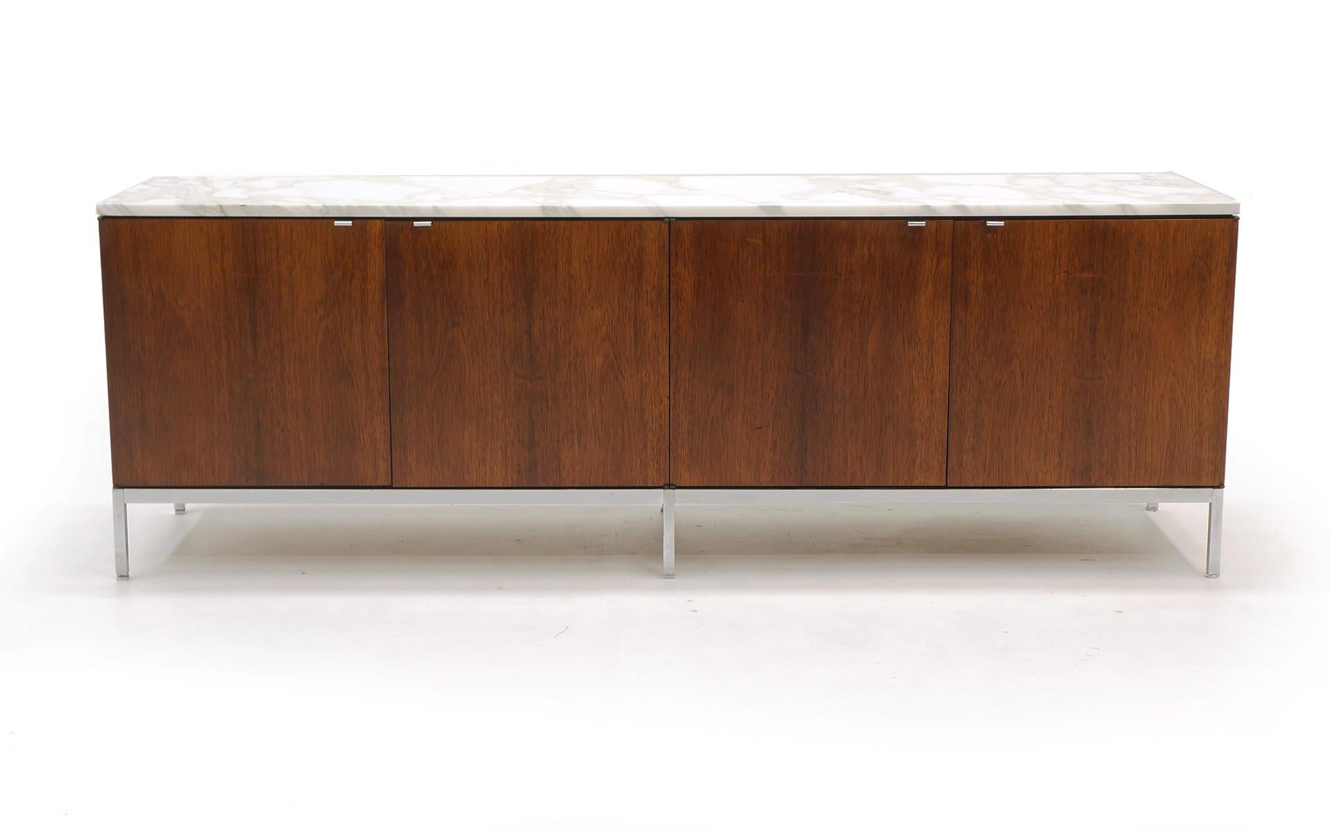 Beautiful matched grain Brazilian rosewood Florence Knoll credenza with white and gray marble top. This is an exceptional example of this design. Very good to excellent original condition.