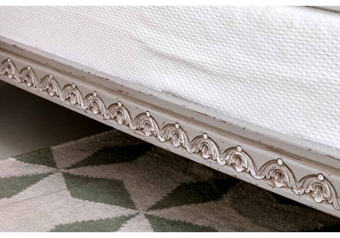 Desirable Queen Bed with double-wall caned headboard and footboard in a fine custom Gray painted finish. The frame profusely carved with flowers and many other fine details. The caning on both headboard and footboard is also Gray however there is a