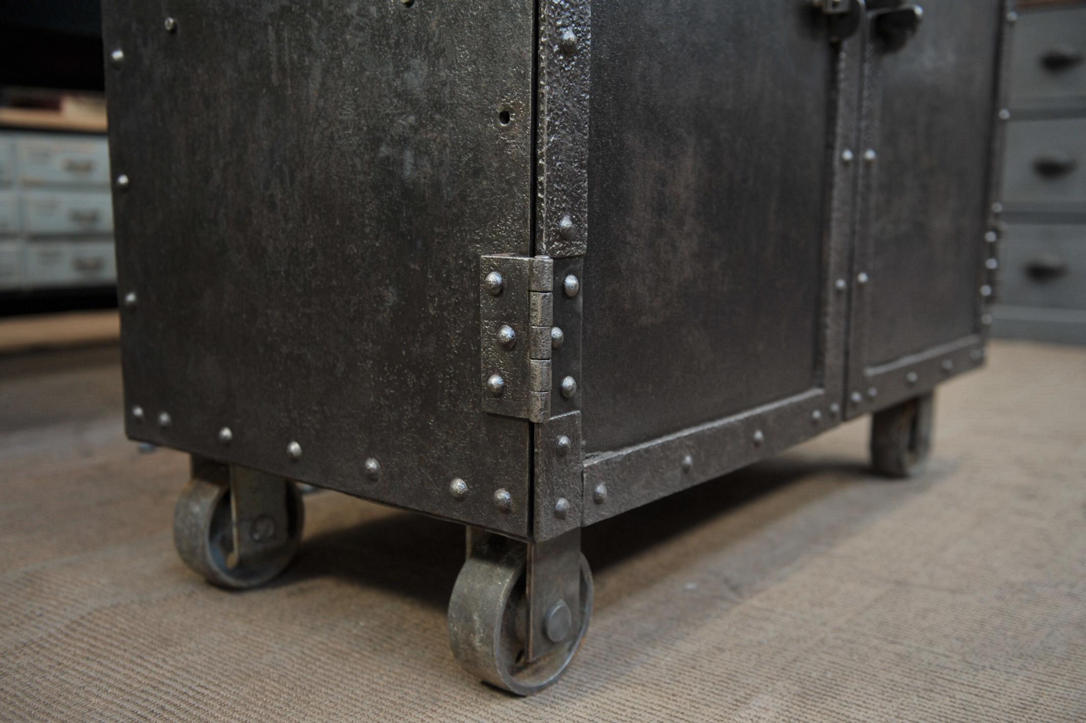 French Exceptional Four-Doors Industrial Riveted Iron Cabinet on Wheels, circa 1900