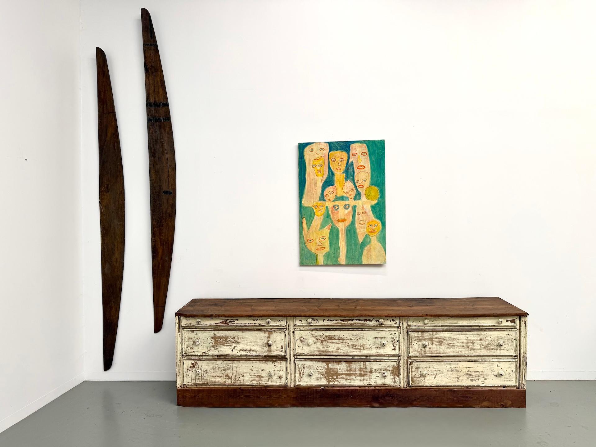 Maison Lecan presents an exceptional draper’s cabinet in pine, circa 1900. A rare and singular piece, it stands out for its sculptural presence and superb original patina — a soft ivory tone worn by time, revealing the beauty of age and