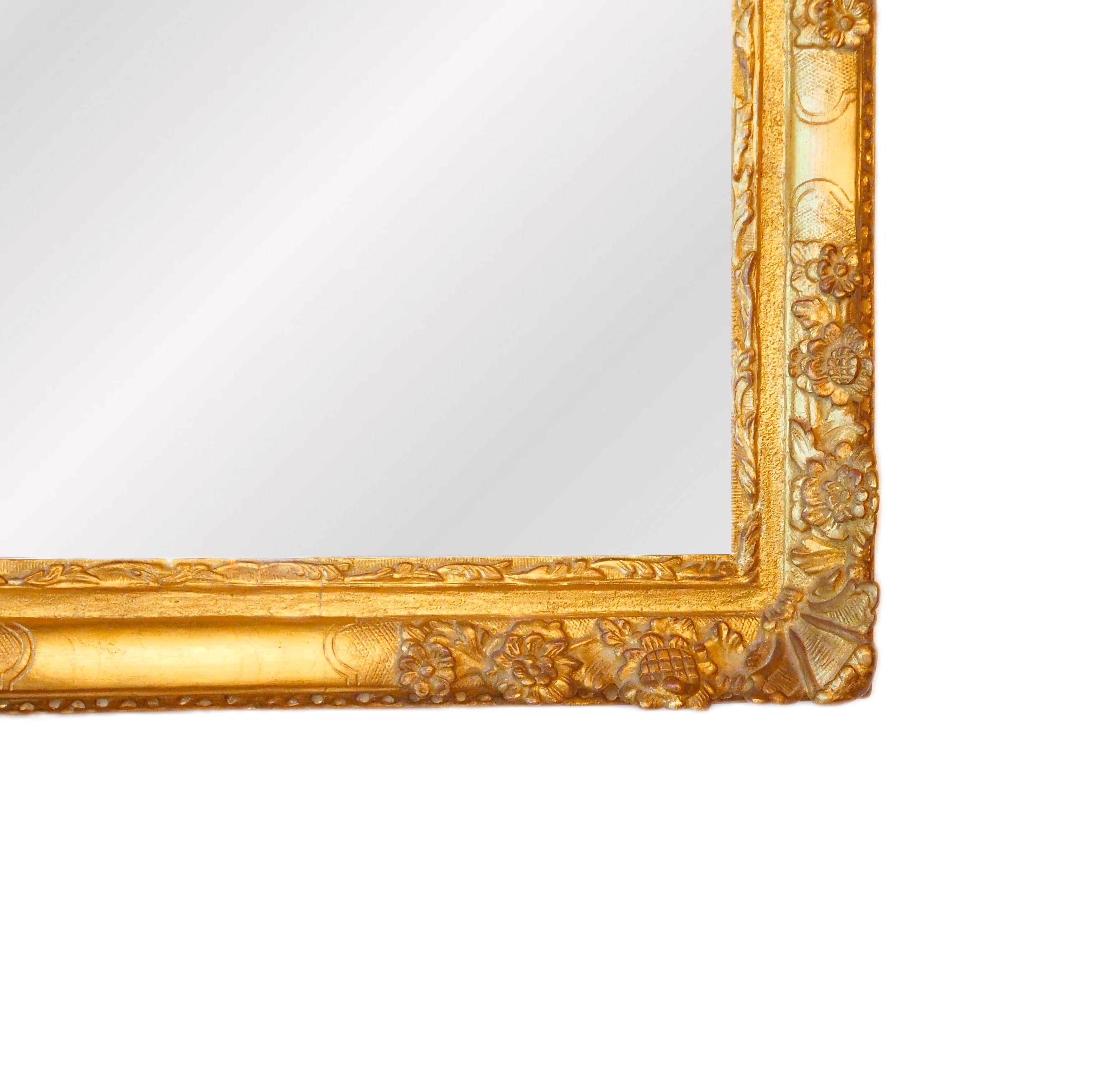 Elevate your decor with this Exceptional Mid-19th Century French Giltwood Frame Rectangular hanging Wall Mirror, a masterpiece that exudes opulence and timeless elegance. This mirror boasts a rectangular shape, serving both functional and aesthetic