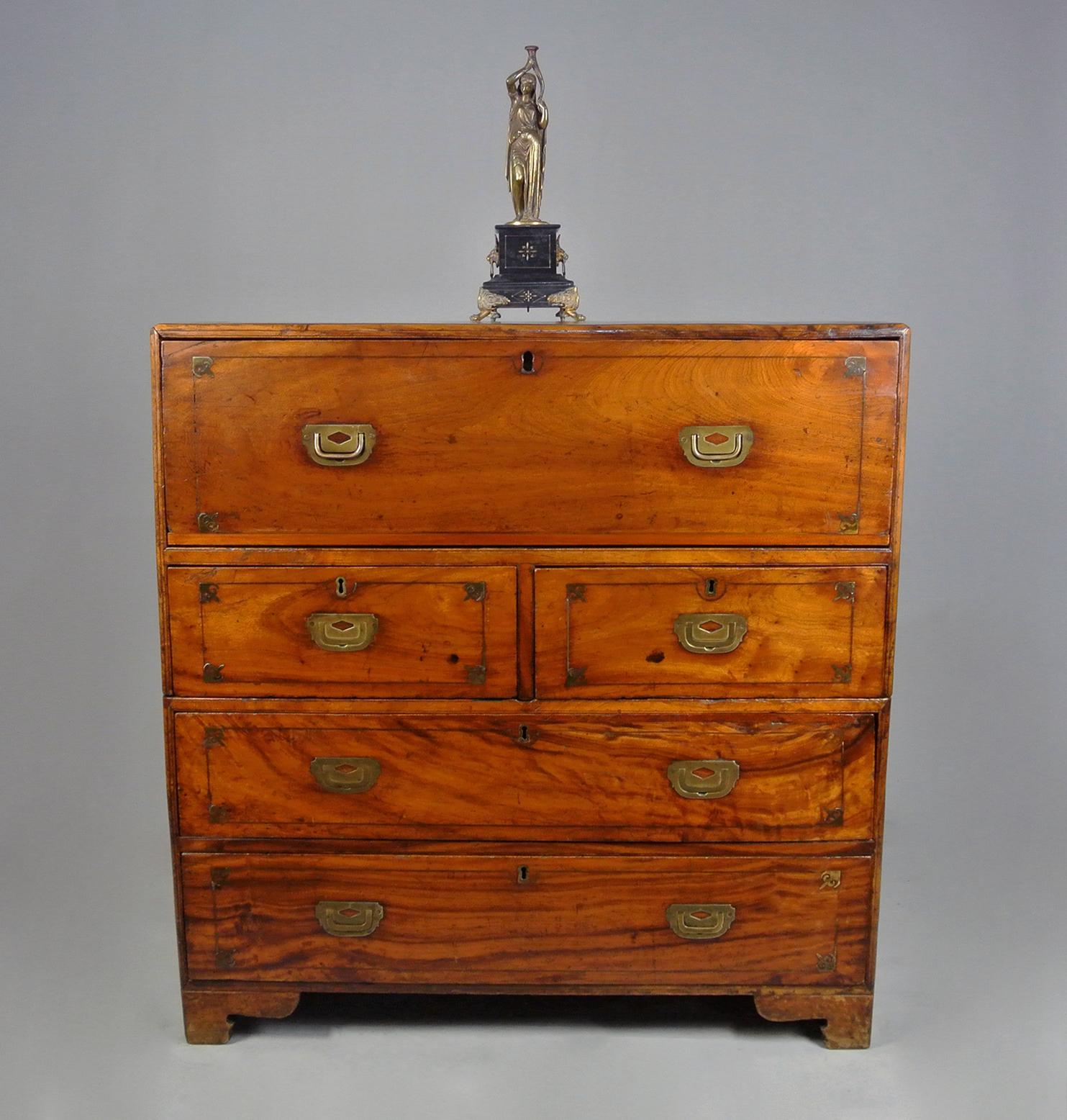 An exceptional and original Georgian campaign chest with brass inlays and original flush brass handles and having an absolutely superb colour with wonderful chatoyancy to the timber and rich natural patina.

The interior with two banks of short