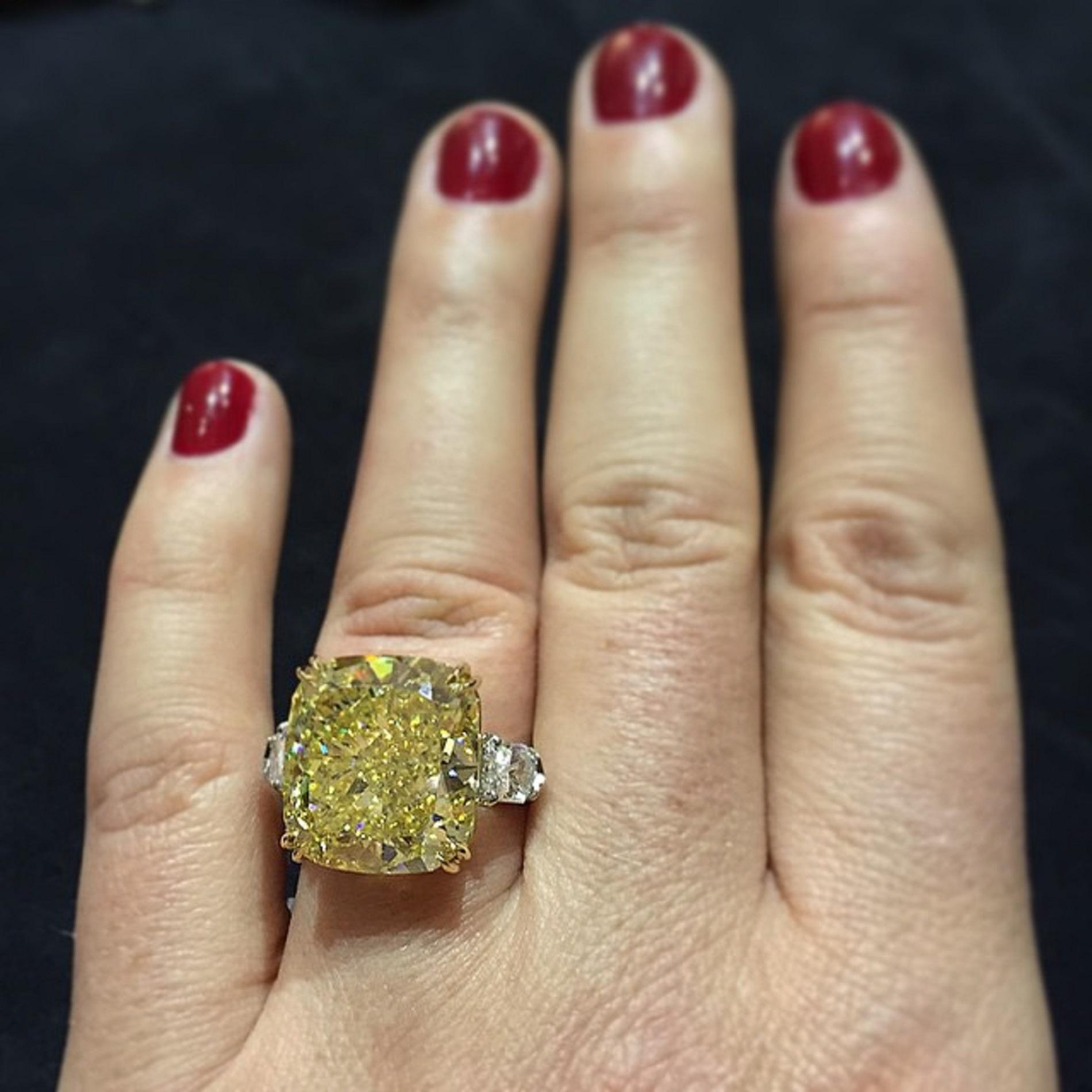 Embark on a journey of unparalleled beauty with our breathtaking 13.40-carat Radiant Fancy Intense Yellow Diamond. This radiant gem, a celebration of nature's artistry, captivates with its intense yellow hue, radiating warmth and joy in every