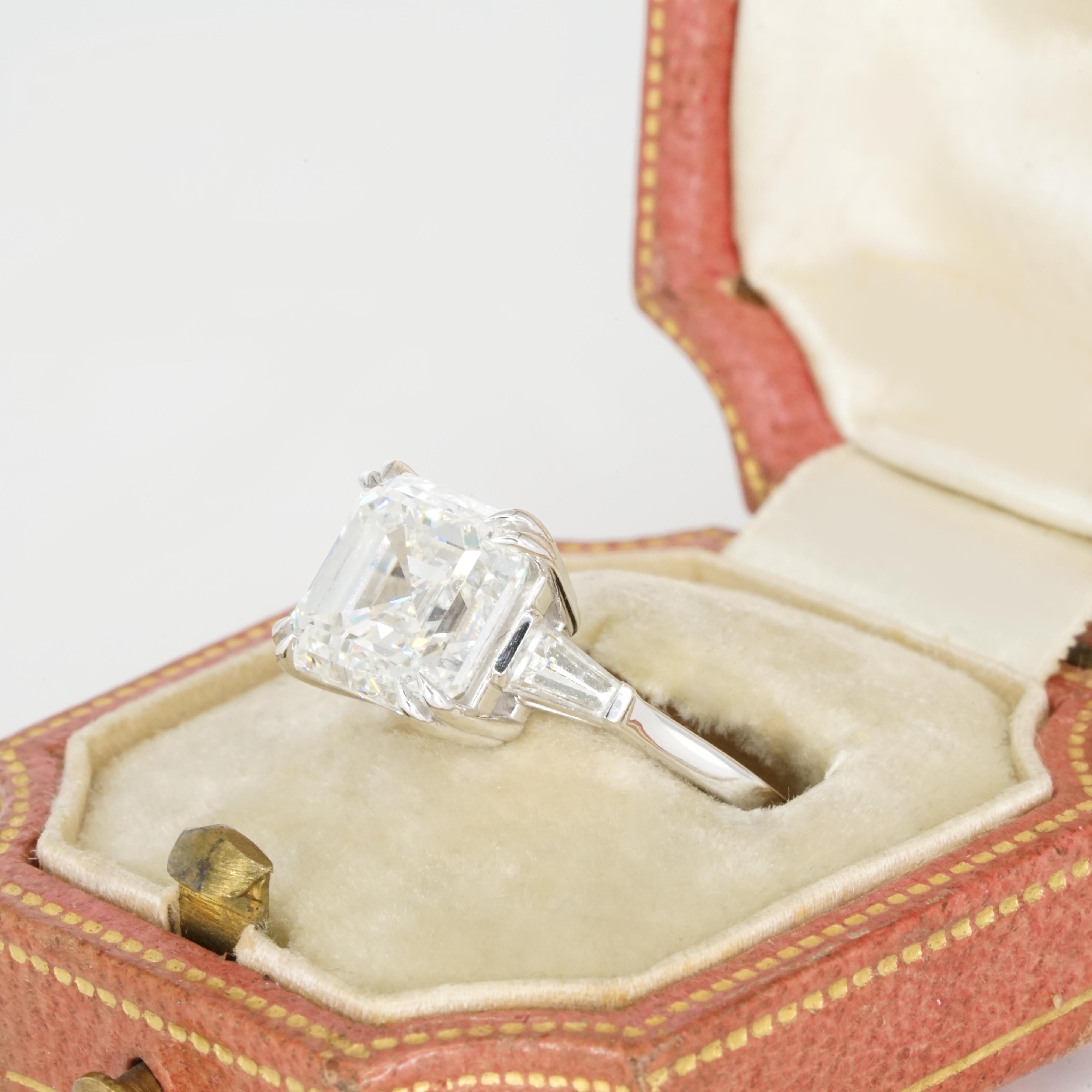 Presenting an exquisite GIA Certified 5-Carat Asscher Cut Diamond set in a luxurious platinum band. This exceptional diamond boasts an I color grade, offering a pristine near-colorless appearance, and VS2 clarity, ensuring only very slight