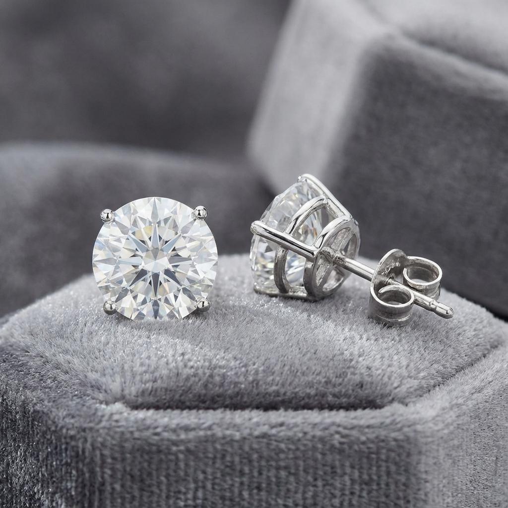 This refined platinum jewel is set with two magnificent GIA-certified round brilliant diamonds, each weighing 3.01 carats, carefully selected for their harmonious proportions, bright white color, and elegant brilliance.

Both diamonds are graded F