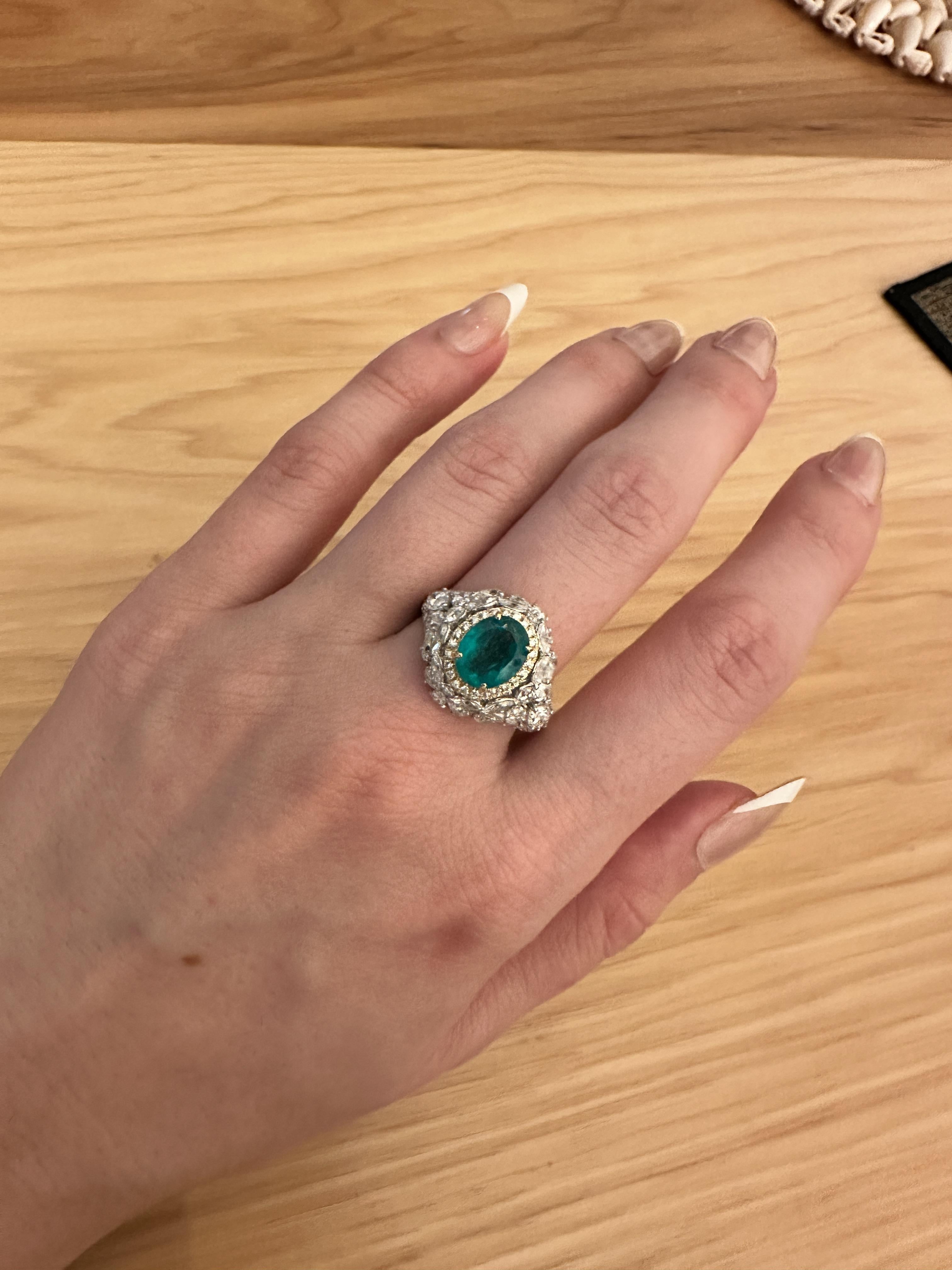 This emerald perfectly captures the pure green glow of the legendary Muzo mine in Colombia. Standing tall at 1.7 carats, it has the presence of a 2.5 carat emerald. When designing a setting for this future family heirloom, we went all out!!