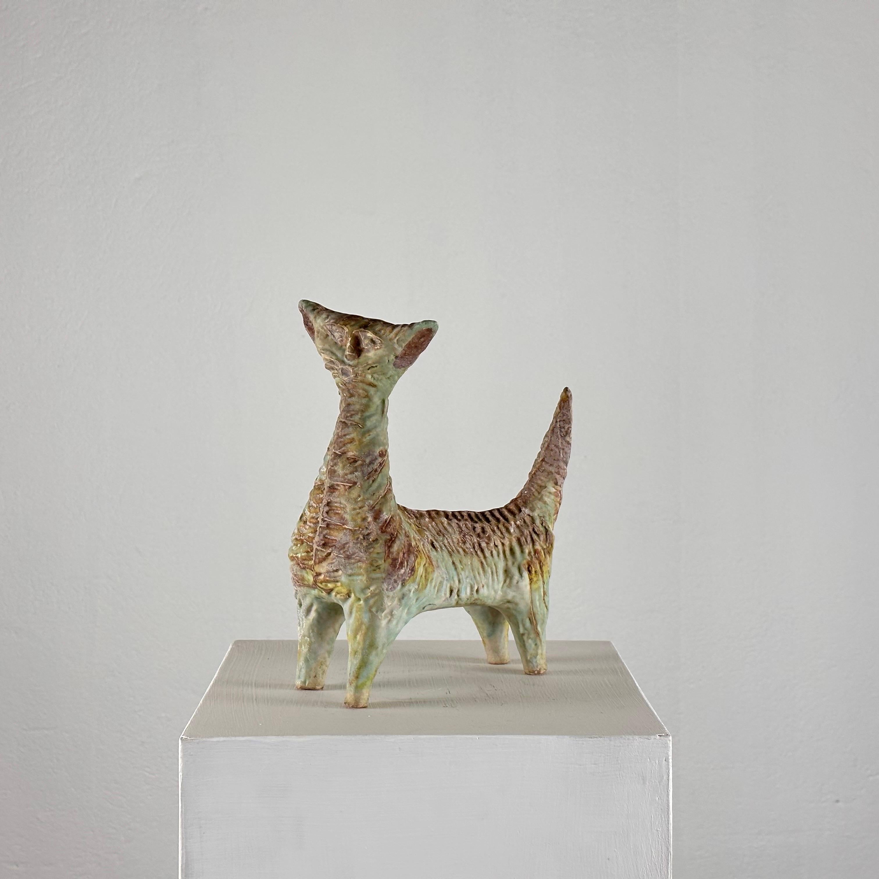 
Capture the essence of mid-century Italian craftsmanship with this extraordinary ceramic cat created by Giovan Battista Mitri in the 1950s. Renowned for his mastery of form and color, Mitri's work continues to captivate collectors and enthusiasts
