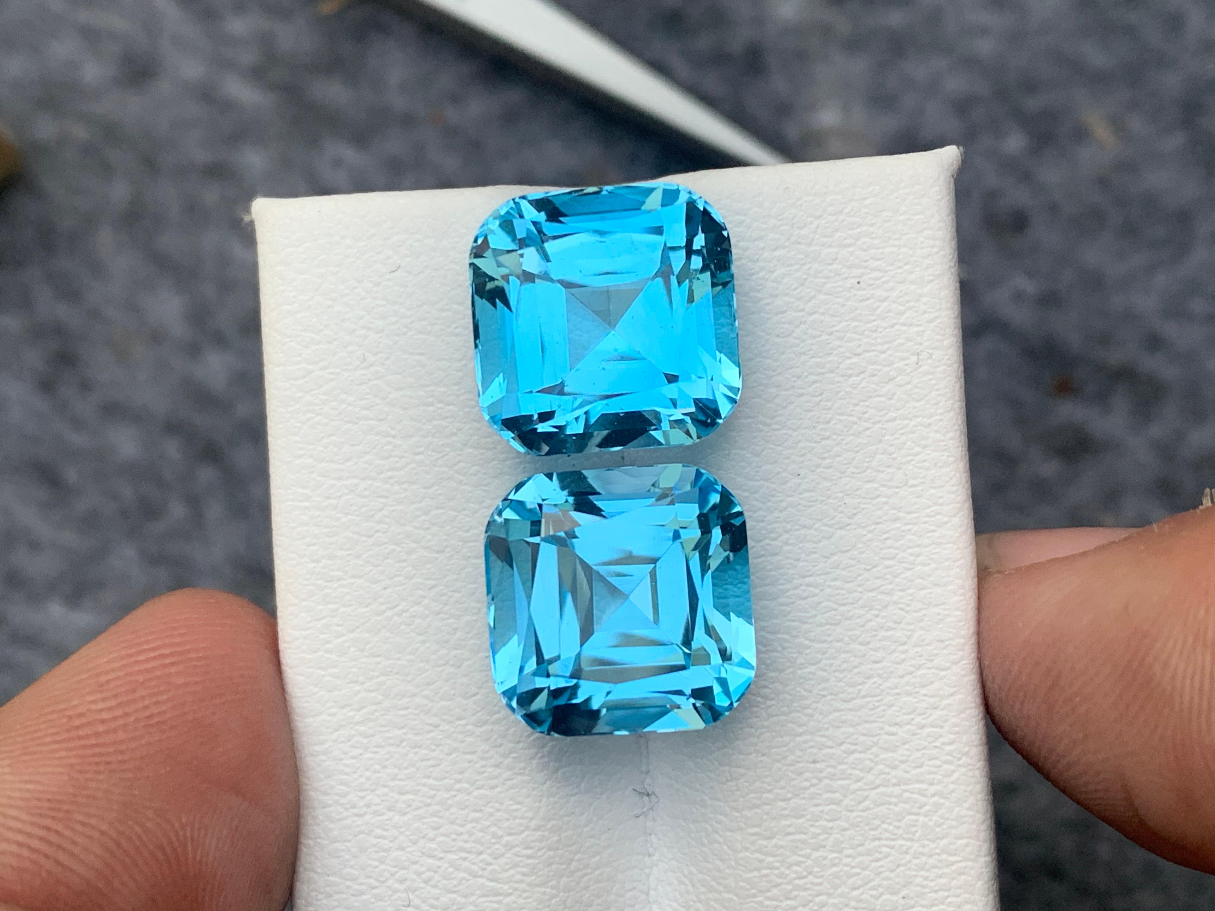 Faceted Sky Blue Topaz 
Weight : 25.40 Carats
Dimensions : 12.1x12.1x9.8 Mm
Origin : Brazil
Clarity : Eye Clean
Shape: Cushion
Color: Blue
Certificate: On Demand
.
Blue Topaz Metaphysical Properties
Blue topaz, in particular, is believed to promote
