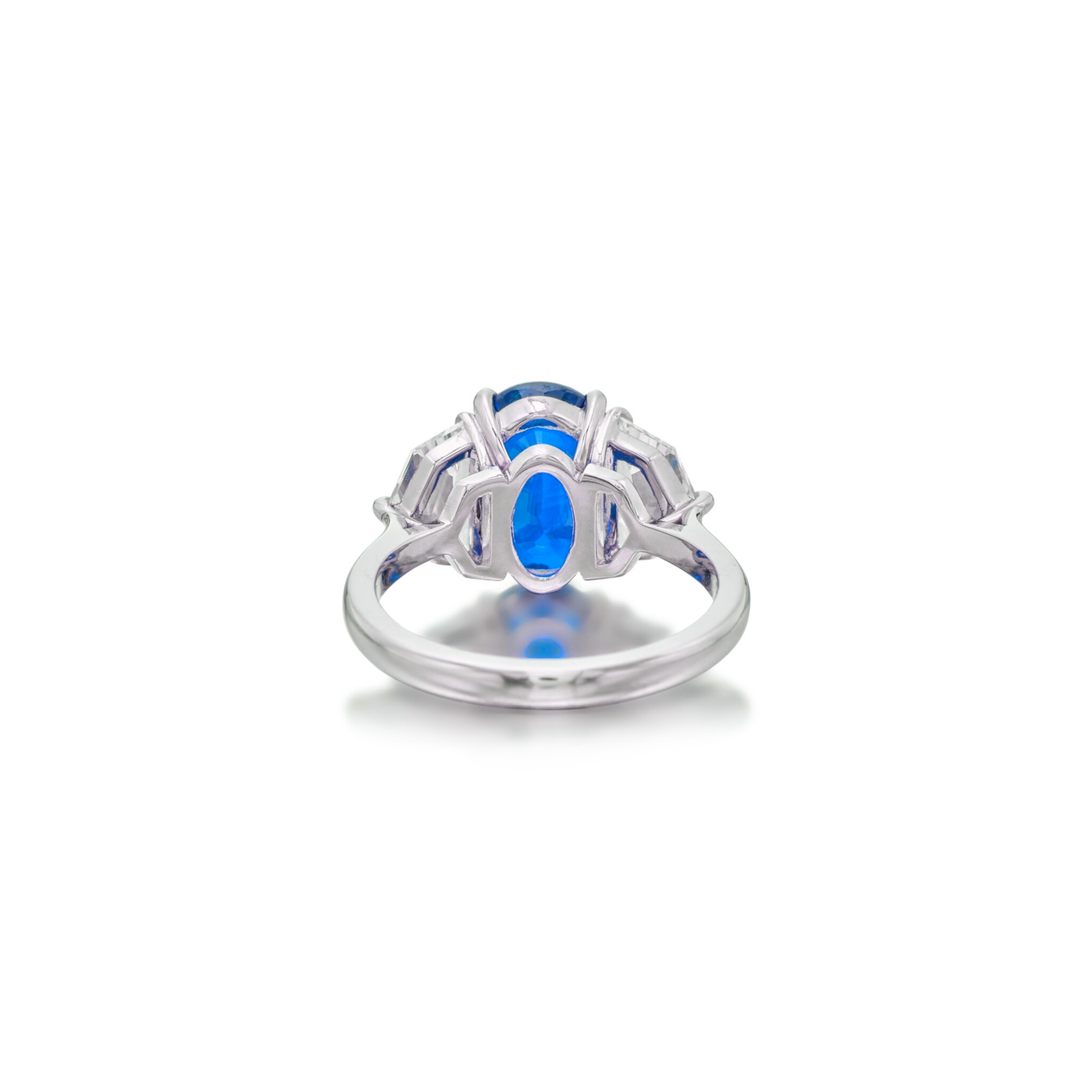 Centering an oval-shaped blue sapphire, set between a pair of epaulette diamonds.

Blue sapphire weighing 2 carats
Diamonds weighing a total of approximately 0.80 carats
Size 7
