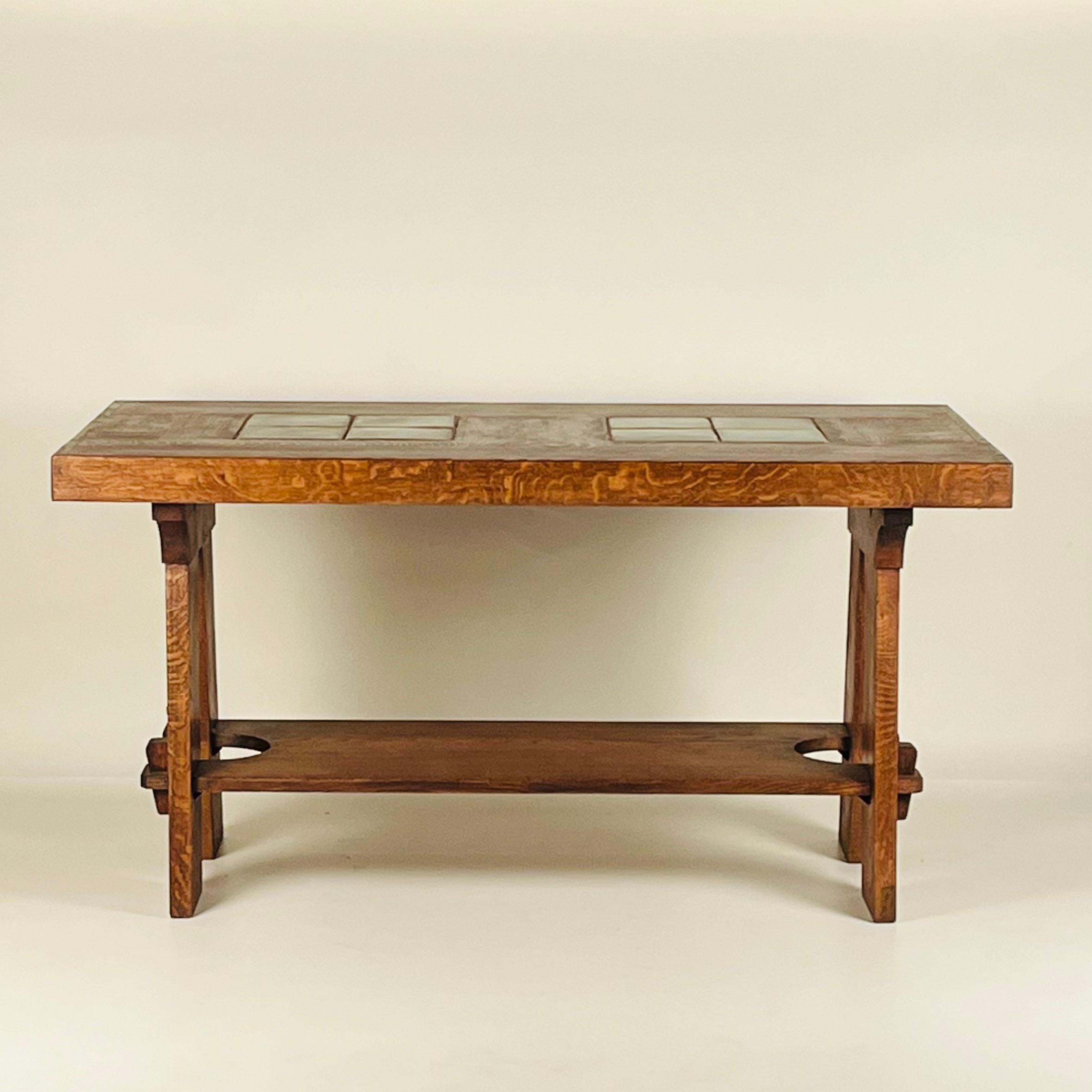 This design is a great example of the collaboration between Gustav Stickley and the Grueby Faience Company.

The top is 2 1/2 in. thick and the little shelf on the bottom is 8 in. from the floor.