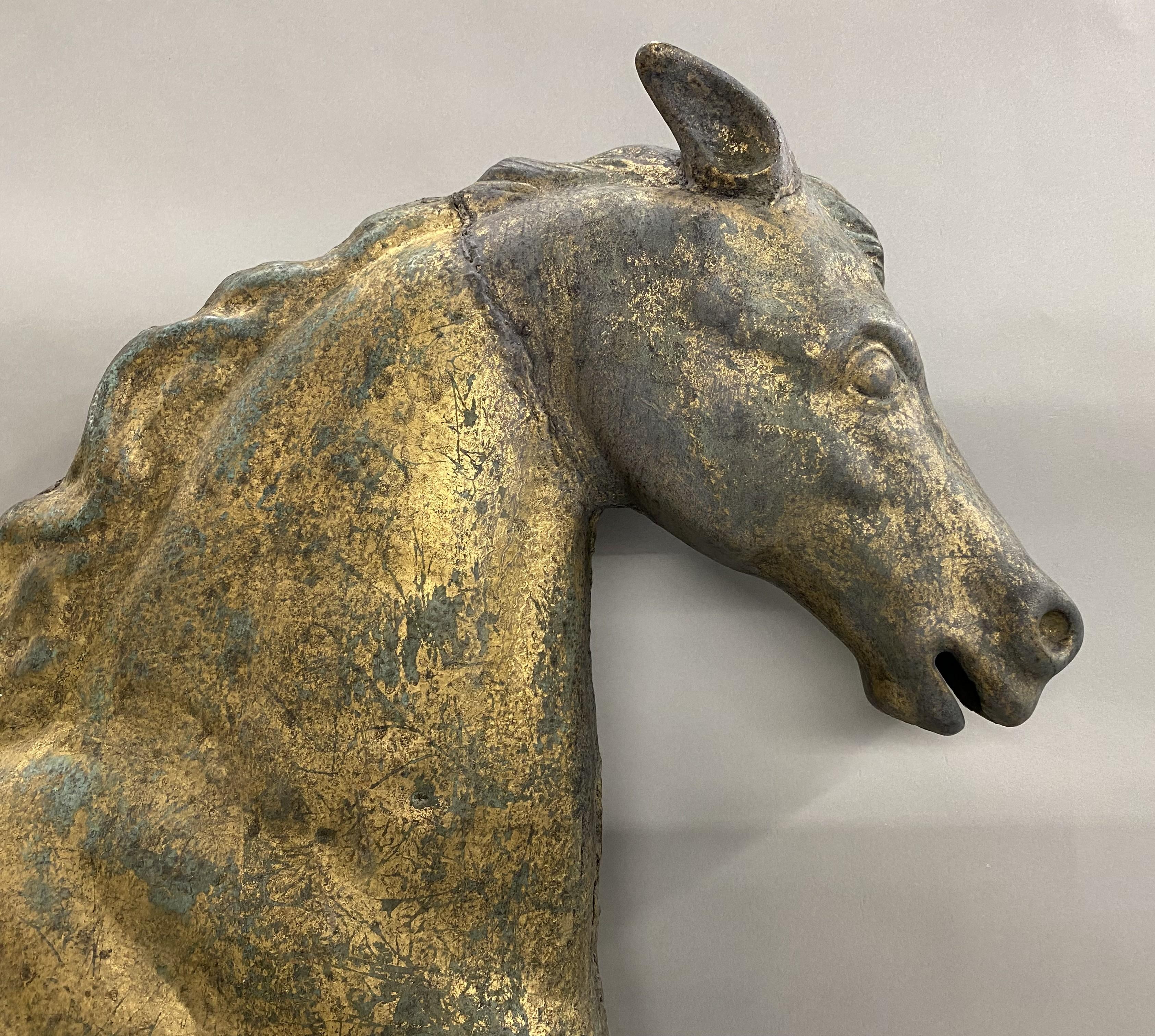 An exceptional gilt copper running horse weather vane made by Harris & Co, Boston. Harris & Co was purchased in 1868 by the father/son team Josephus and Ansel Harris and run by Ansel alone until 1882 after his father's demise in 1870. This handsome
