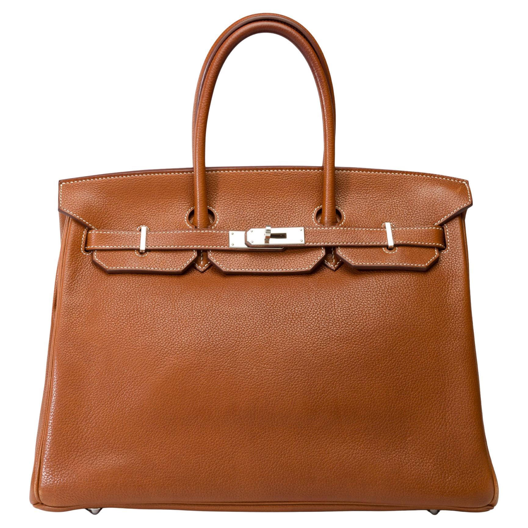 Exceptional​ ​Hermès​ ​Birkin​ ​35​ ​handbag​ ​in​ ​Fauve​ ​Faubourg​ ​Barenia​ ​leather,​ ​Palladium​ ​silver​ ​metal​ ​trim,​ ​double​ ​brown​ ​leather​ ​handle​ ​for​ ​hand​ ​carry​ ​​ ​

Closure:​ ​Flap
Interior​ ​Lining:​ ​Leather,​ ​one​ ​zip​