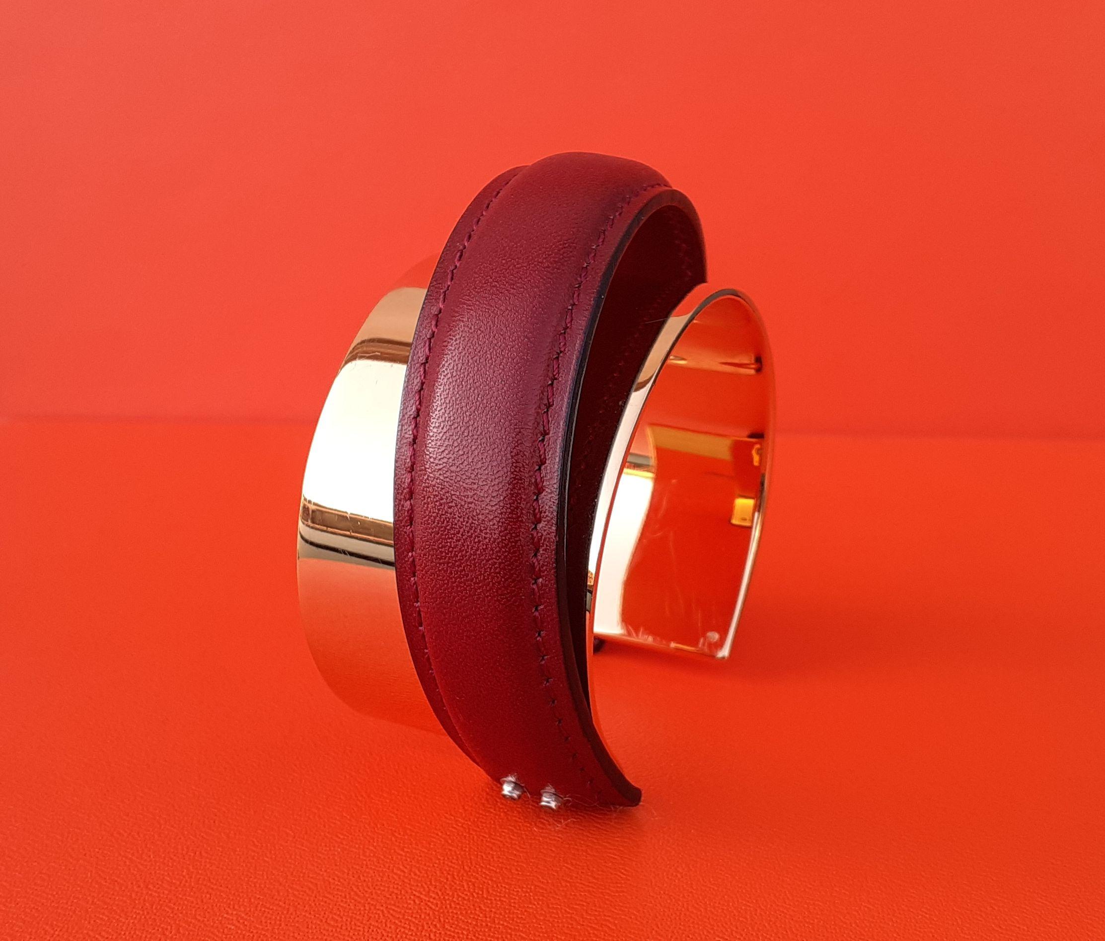 Super Rare and Absolutely Gorgeous Authentic Hermès Bracelet

Composed of a cuff in gilded metal, enhanced in relief with a rigid strip of smooth red leather, connecting the 2 ends of the metal diagonally

There is a hallmark, but can not say if the