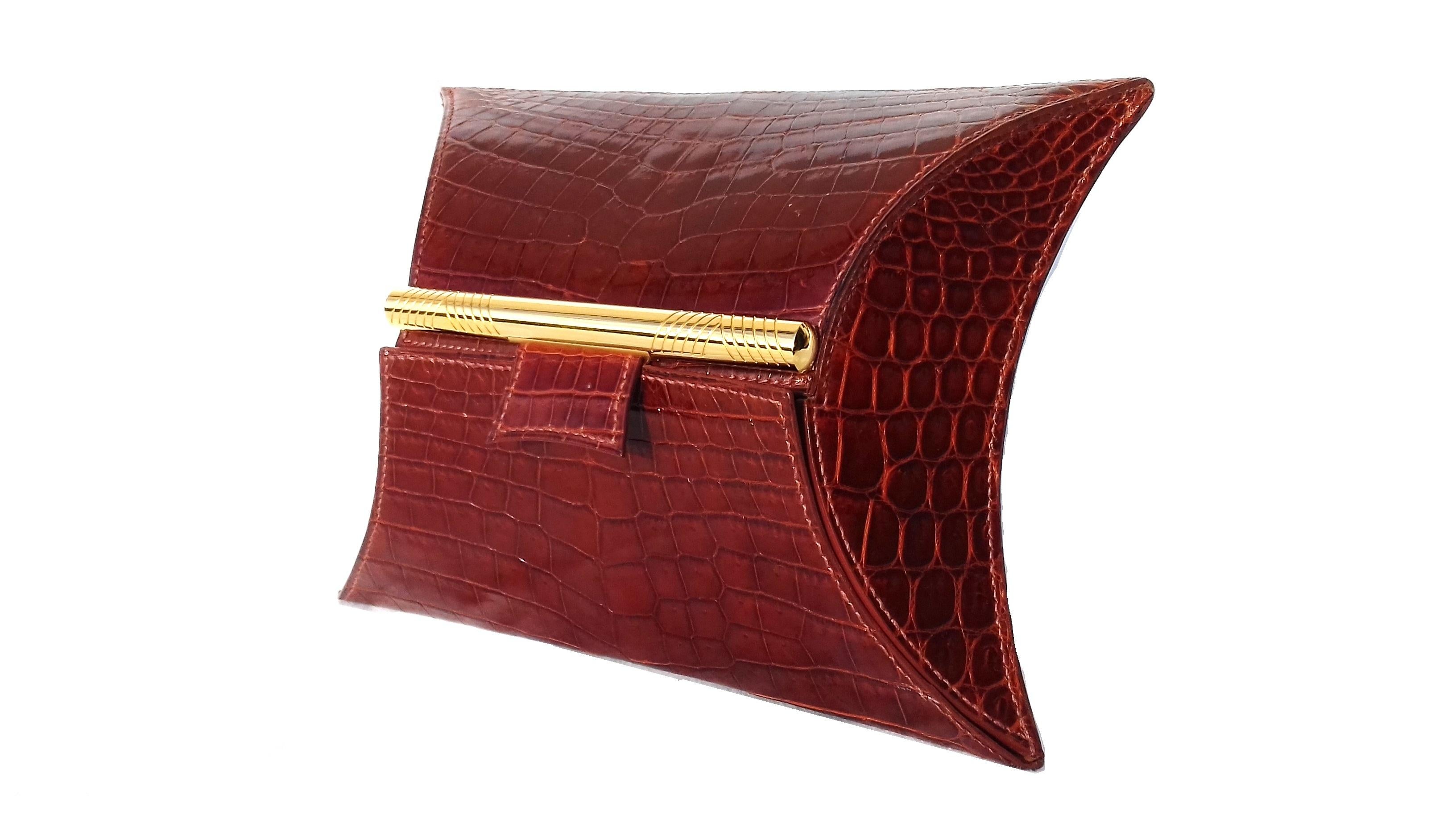 Absolutely Gorgeous Authentic Hermès Purse

Absolutely divine, a jewel

Made in France

Stamp A in square (1997)

Made of shiny niloticus crocodile and golden hardware

Lined with lamskin smooth leather

Colorway: Light Brown

