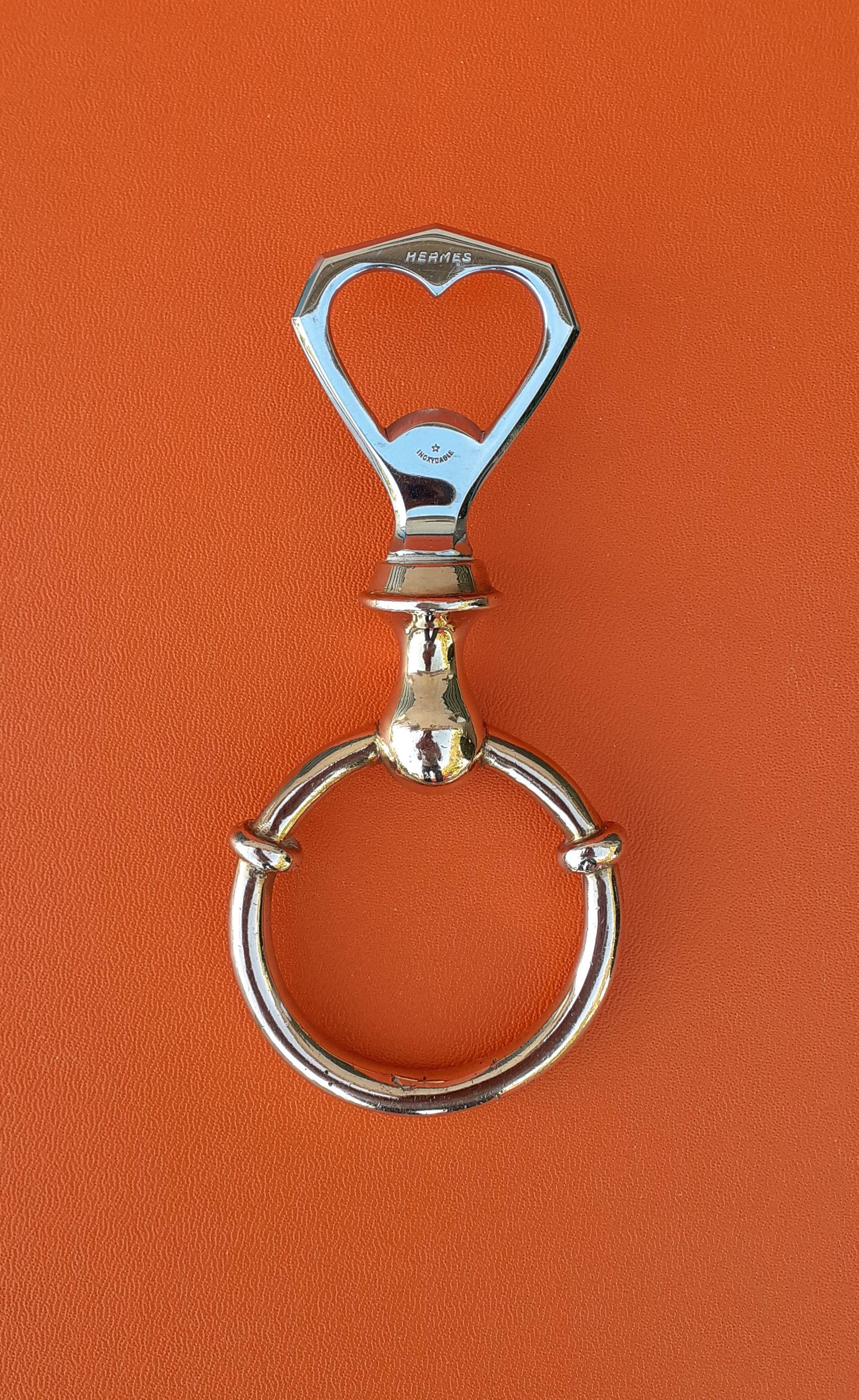 Rare and Beautiful Authentic Hermès Bottle Opener

In shape of a horse bit

Made in France

Made of silvery and golden non-precious stainless metal

