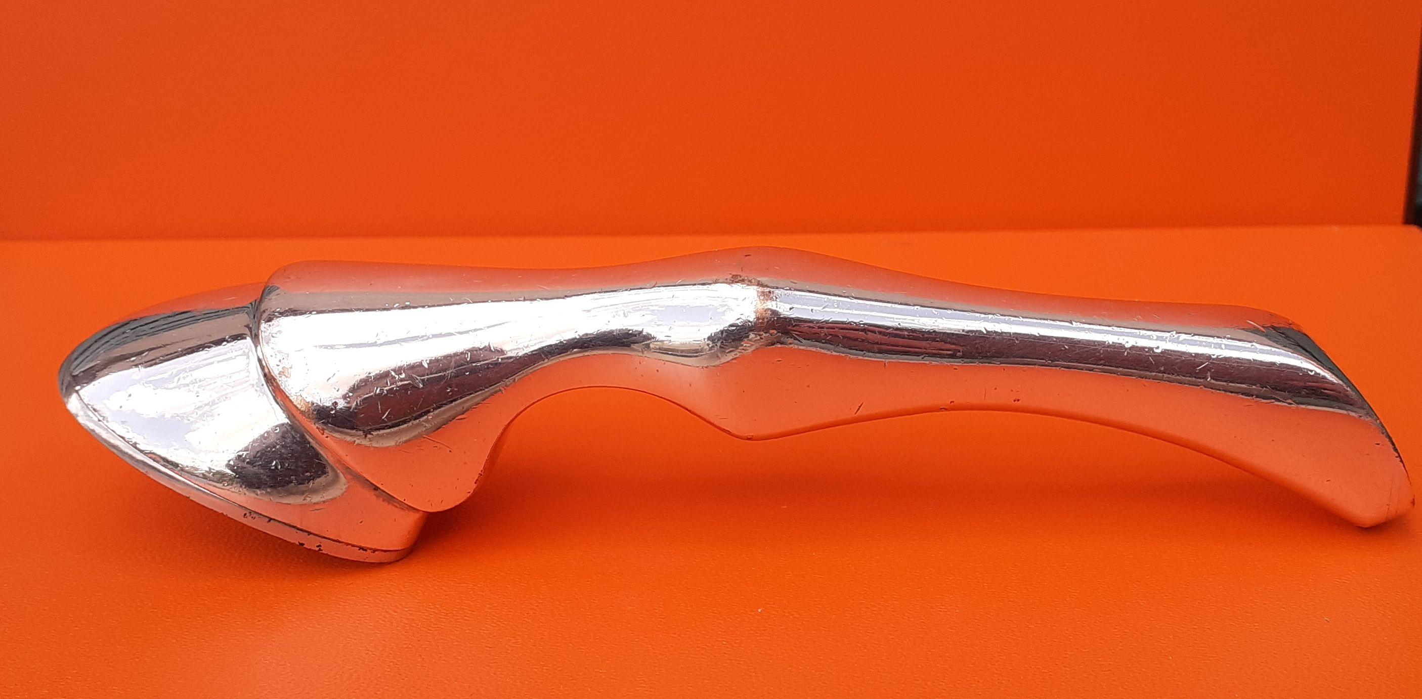 Rare and Beautiful Authentic Hermès Bottle Opener

Shaped like a horse's leg, ending in a horseshoe bottle opener

Made in France

Vintage Item

Made of silver-tone Metal

