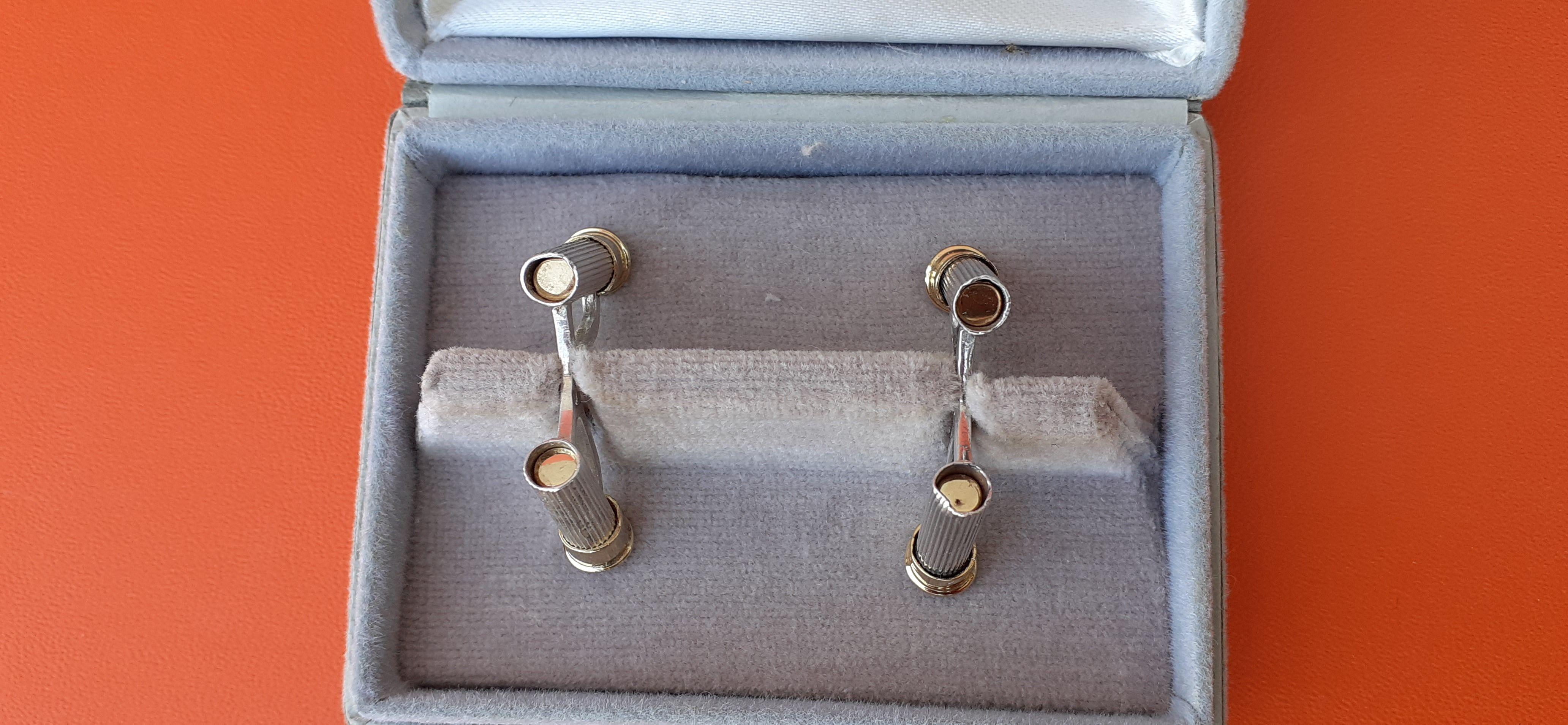 Exceptionnelle paire de boutons de manchette Hermès en forme de douille de fusil à pompe en argent et or. en vente 13