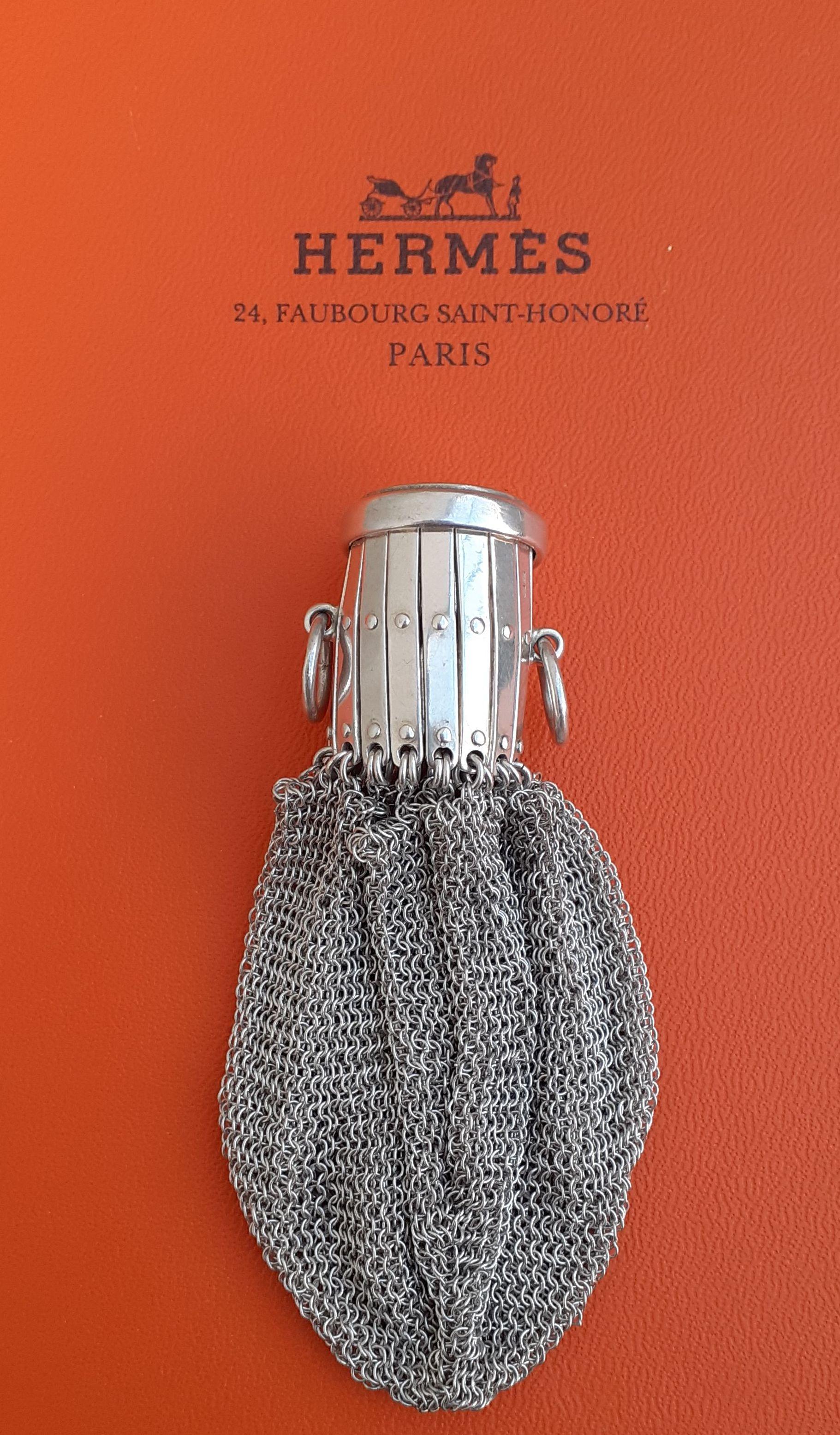 Extremely Rare Authentic Hermès Chainmail Coin Purse 

The purse is made of fluid meshes, enhanced by a retractable opening, which closes by a lid. 2 small rings on the sides

Made of Silver 835 (83,5% of Silver)

