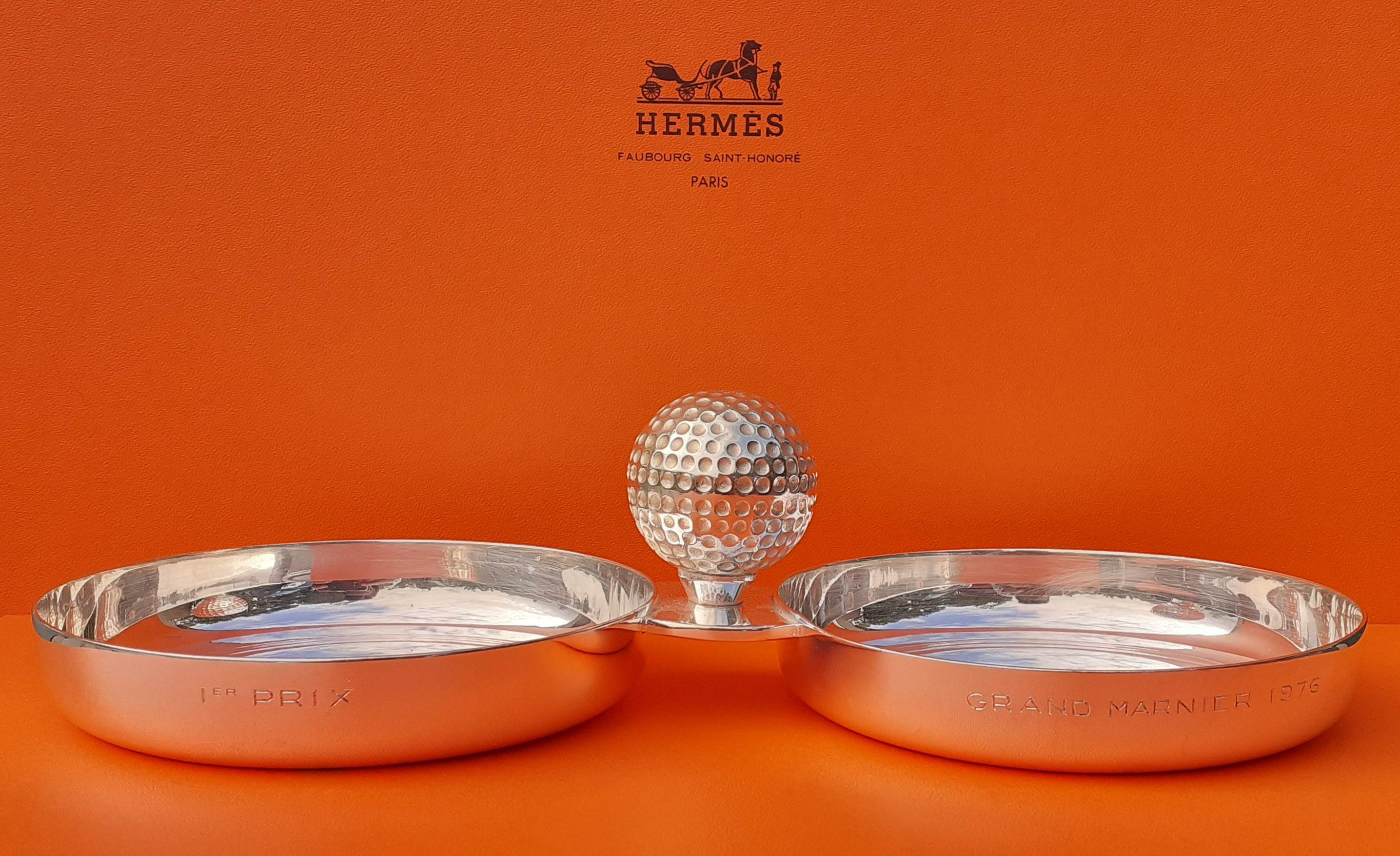 Exceptional Authentic Hermès Change Tray

Pattern: Golf

Made in France by Ravinet d'Enfert for Hermès

Vintage item, from the 70's

Made of silver-tone metal

