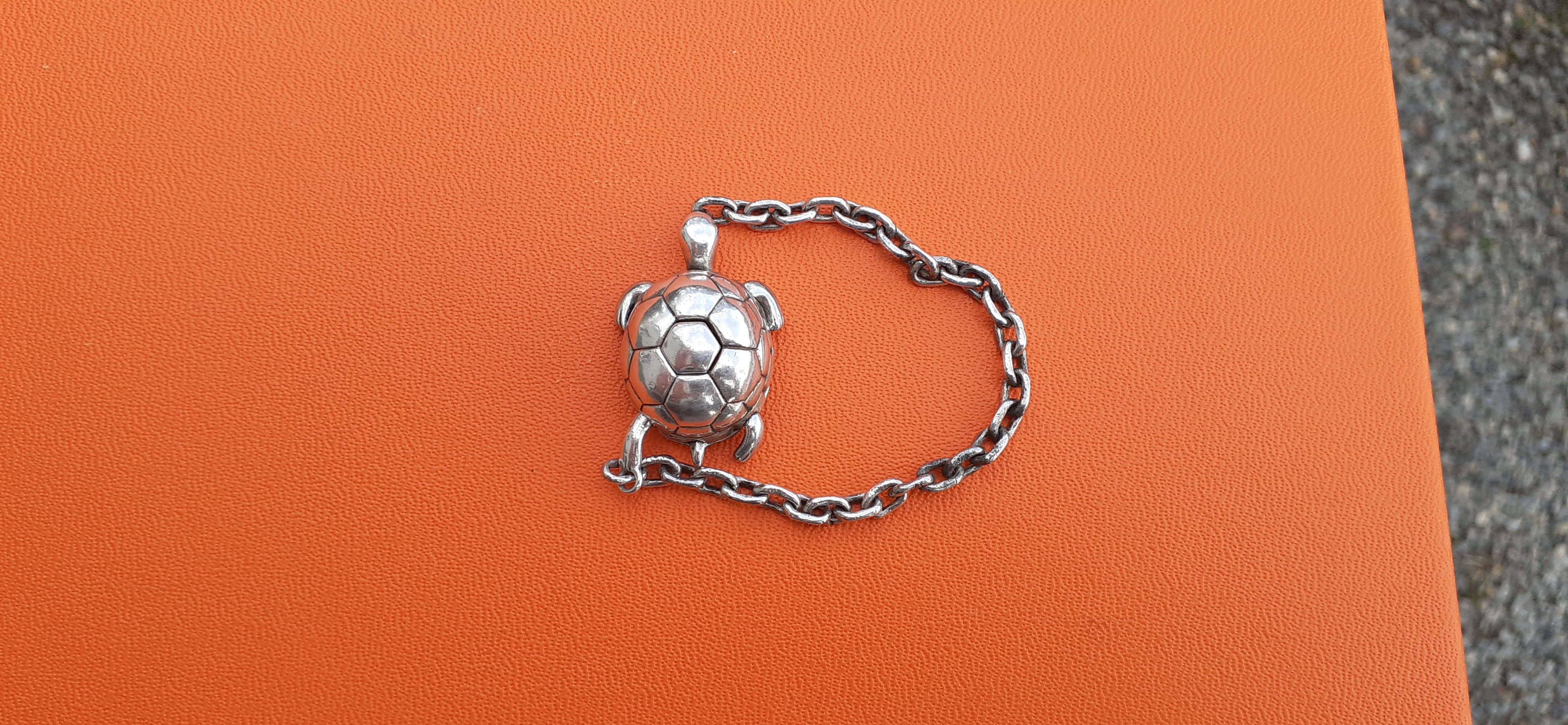 Rare Authentic Hermès Charm or Key Ring

Turtle Shaped

Can be used as Bag Charm or Key Ring

Made of Silver

Vintage Item

Colorway: silvery

Secret mechanism: you have to press on the back of the turtle and pull on its left hind paw at the same