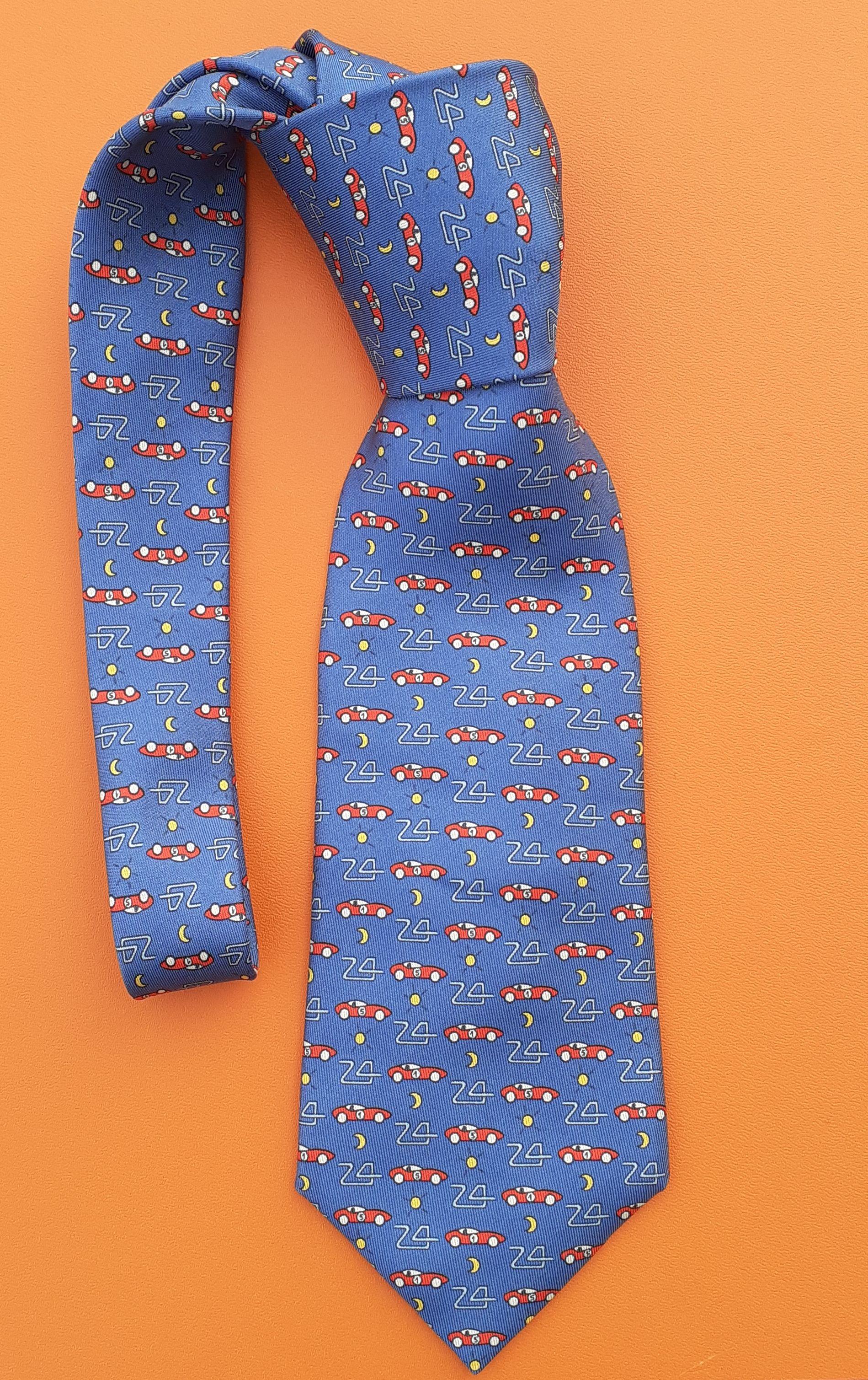 Rare and Lovely Authentic Hermès Tie

Made especially by HERMÈS for the 24 HEURES DU MANS race

Print: Racing cars and a road drawing the number 24

Made in France

Made of 100% Silk

Colorways: Blue, Red, White, Yellow

Lined with plain blue