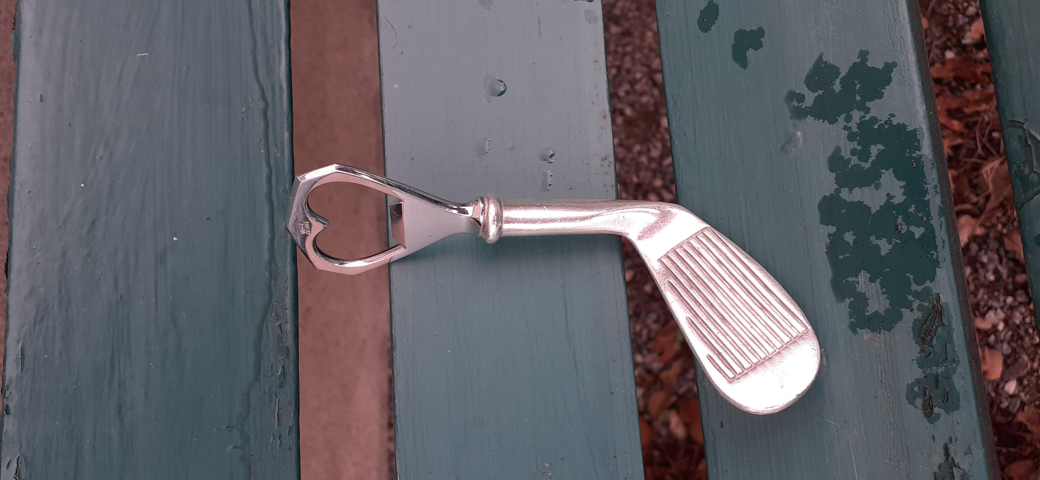 Rare Authentic Hermès Bottle Opener

Shaped like a golf club

Made in France

Vintage Item

Made of inox (stainless steel) and silver-tone non-precious metal

